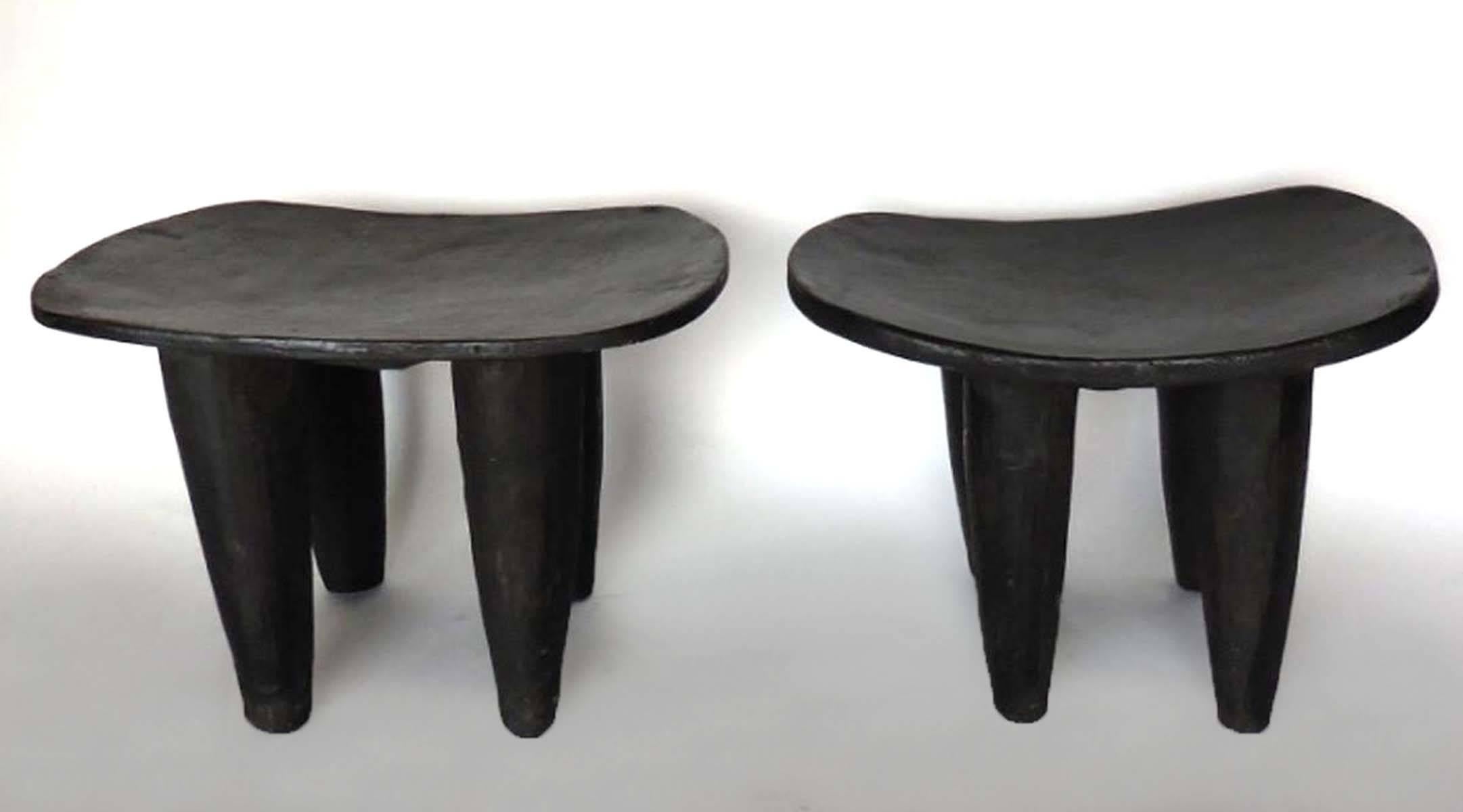 Vintage, hand-carved iroko wood stool or small table from the Senufo tribe in Mali, Africa. Soft and smooth patina. Comfortable to sit on or perfect as a side table. ONLY THE STOOL TO THE RIGHT IS AVAILABLE. 
Right measures 25.25 x 18.5 x 19.5 H.
