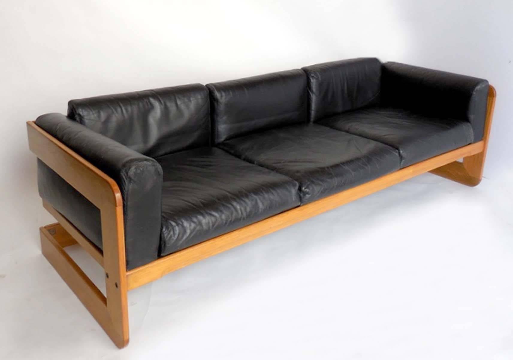 Designed in the 1970s by Guiseppi Raimondo for Stendig. 
Simple, modern and functional. Oak and leather.
Sofa measures 85