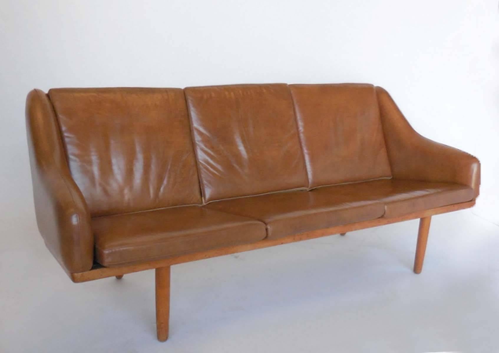 1955 oak framed leather sofa by Poul Volther, Denmark in very good condition. Very light wear considering its age. Cognac color leather.
