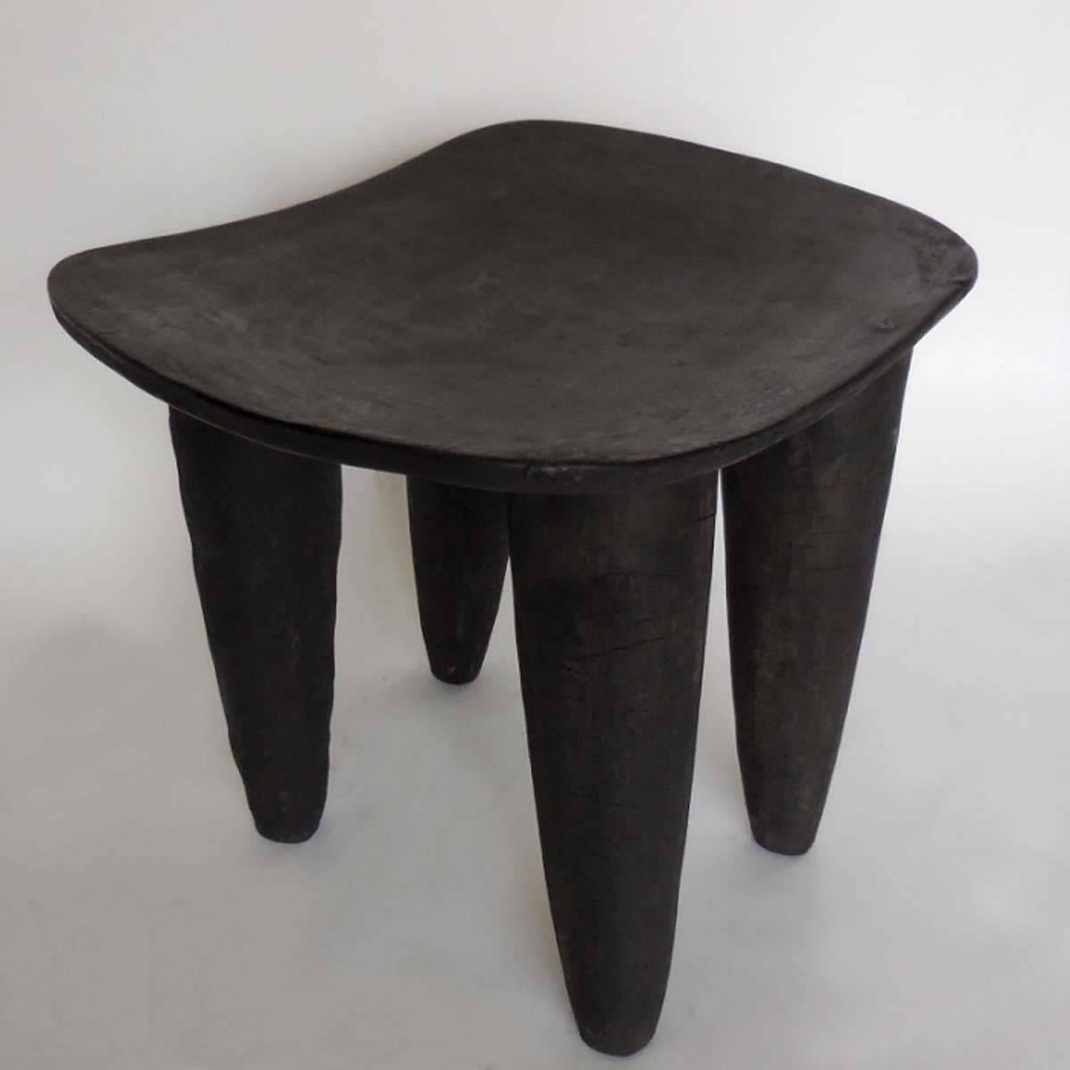 Antique African Senufo tribe stool, carved from one piece of wood. Great old, natural black patina. Great little stool or side table. From Mali.

