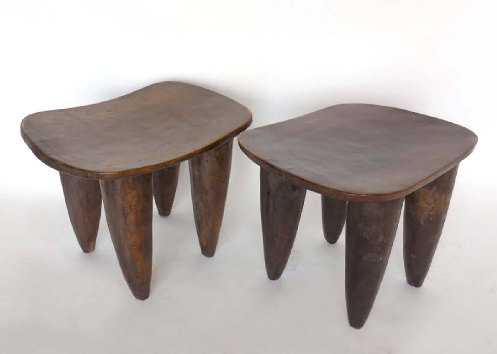 Two hand-carved stools or small side tables from the Senufo tribe of Mali. Each stool is hand-carved out of one piece of wood, early 20th century. Sold separately 
Left measures 25.5 x 23 x 19.5 H
Right measures 26.5 x 22.75 x 20 H.