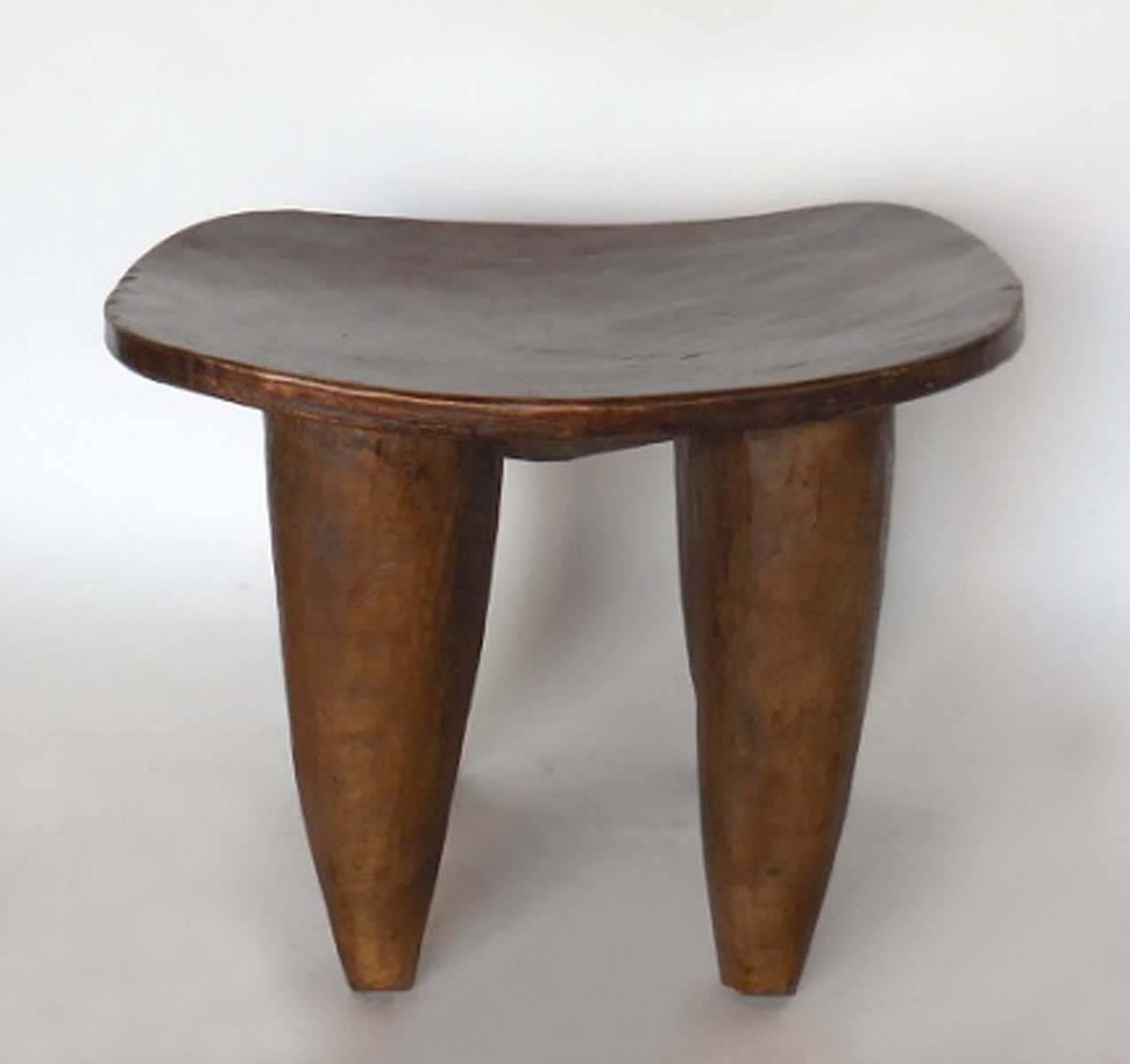 Antique, early 20th century stool or small table carved out of one piece of wood. From the Senufo tribe in Mali.