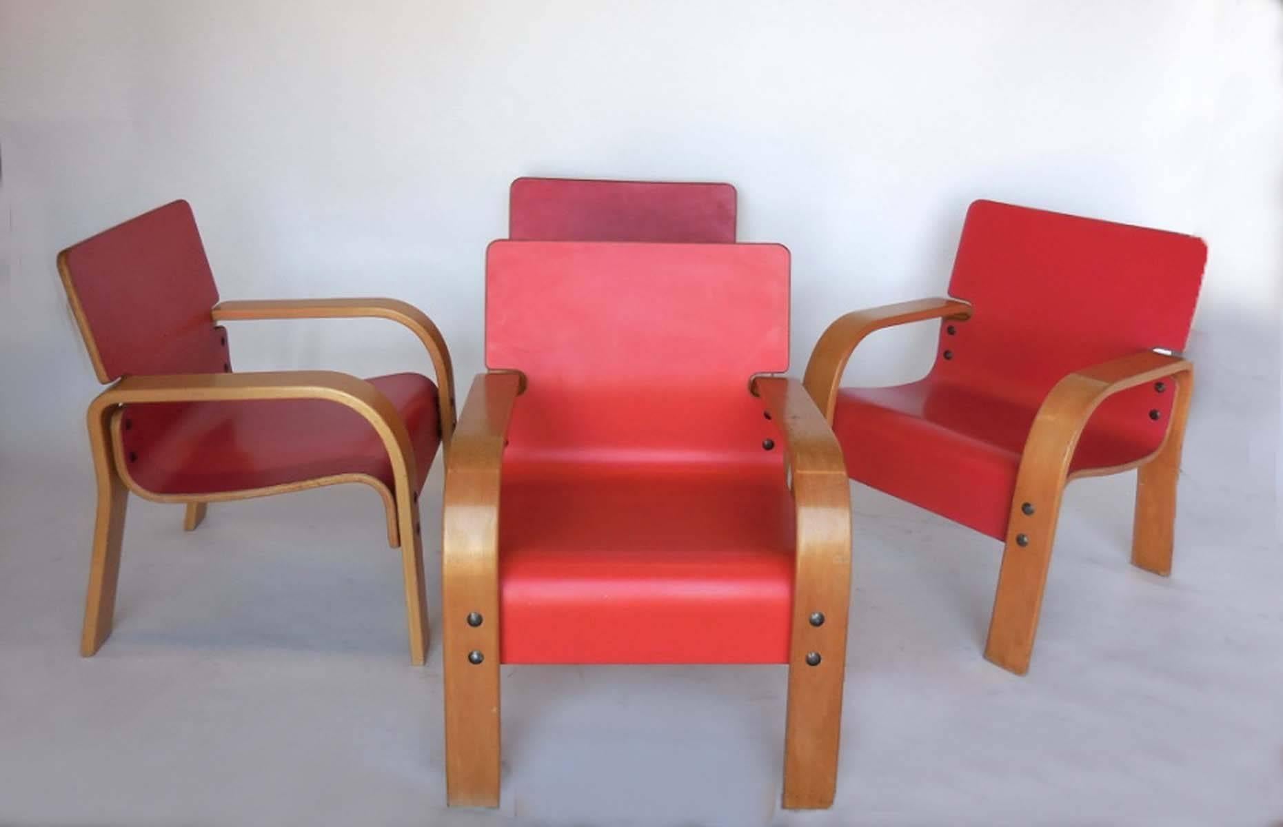 Four bent plywood coral/orange lounge chairs from the 1970s. In very good shape with very little wear. One chair is a bit lighter than the others.
Can be sold separately.