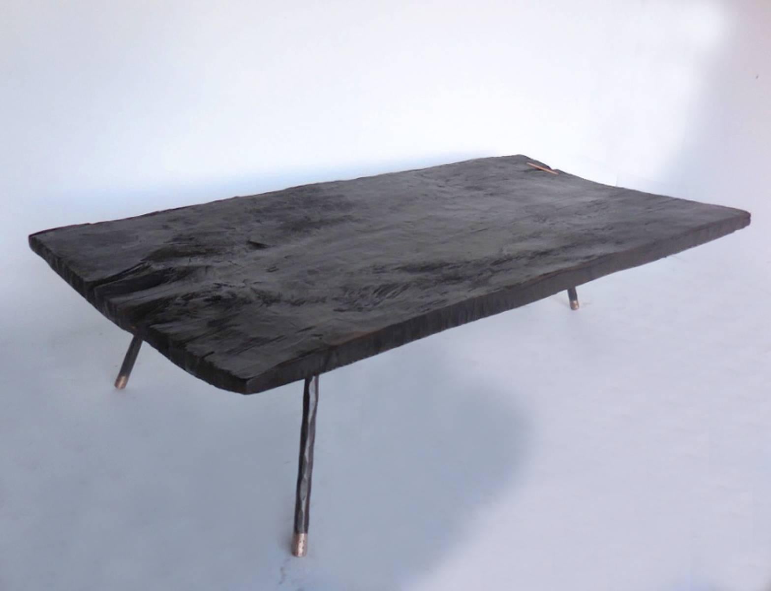 Wide Plank Ebonized Coffee Table with Three Iron and Bronze Legs In Good Condition In Los Angeles, CA