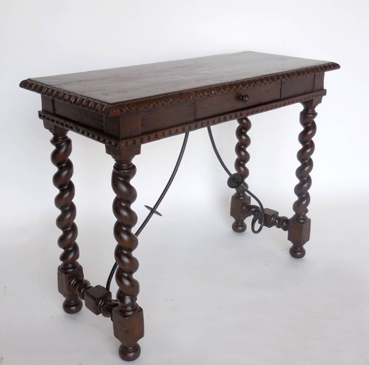 Small scale, petite writing desk with barley twist legs, carved edge and apron detail as well as hand forged iron stretchers. As shown, in Walnut with a medium distress. Can be made in custom sizes and finishes. Made in Los Angeles by Dos Gallos