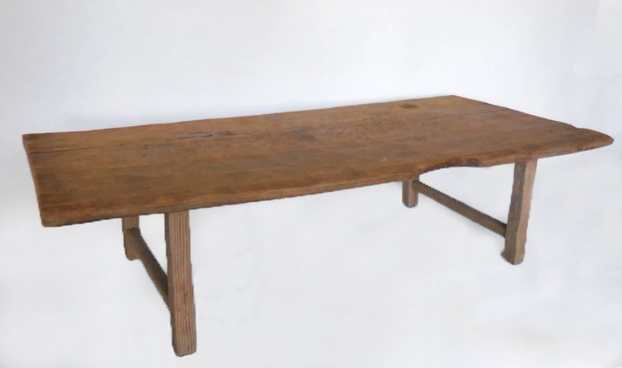 Very old, antique, one wide board atop straight legs. Great natural sun bleached patina. Natural finish. Very rustic. Wear is commensurate with age. See photos. Fully functional and sturdy.