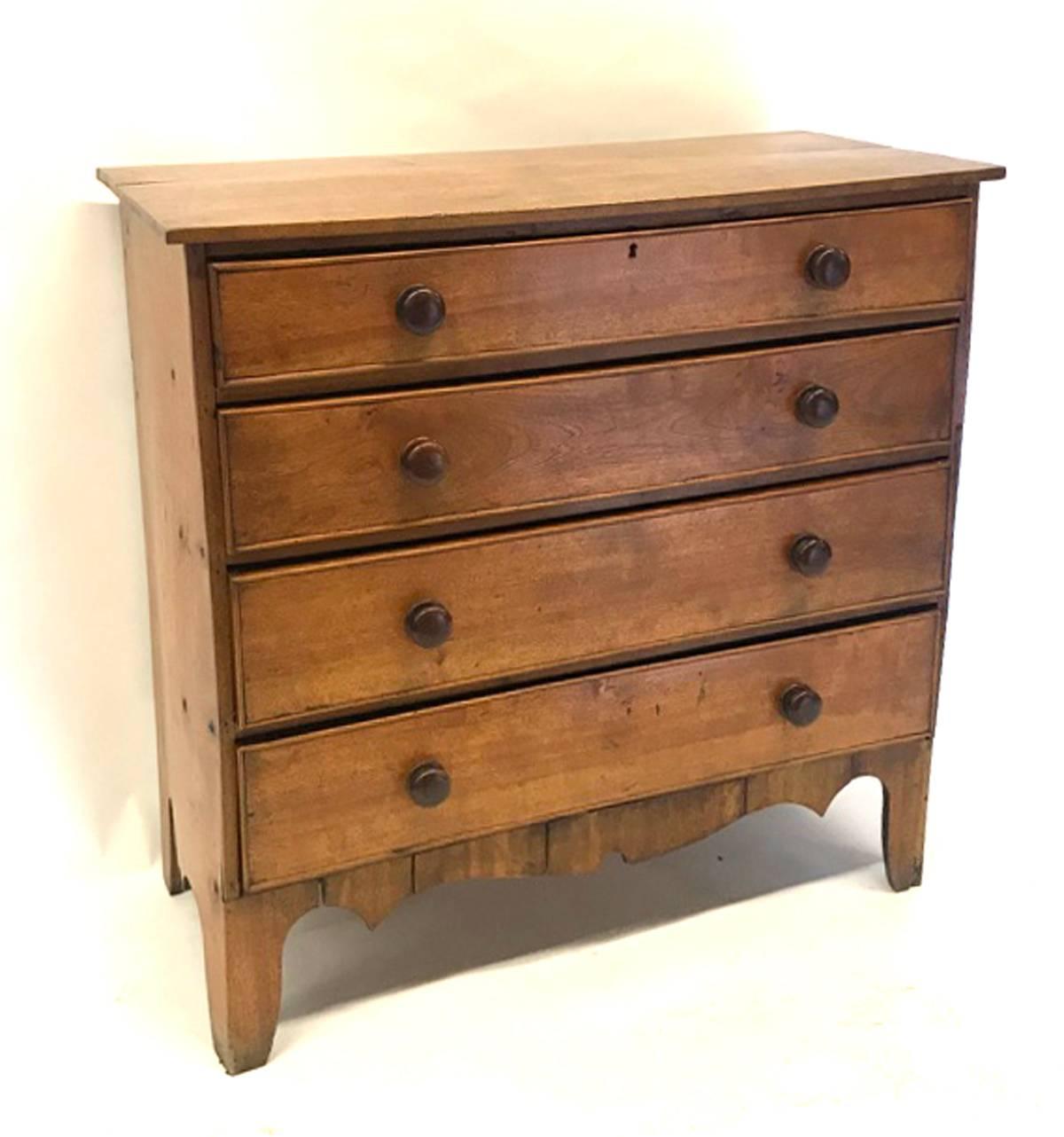 19th century New England four graduated, banded drawer chest in Maple. Flat front. The secondary wood is pine.
Original knobs, old repairs. One wide board on top. Beautiful honey color. Condition commensurate with age. Some bowing on the sides.
