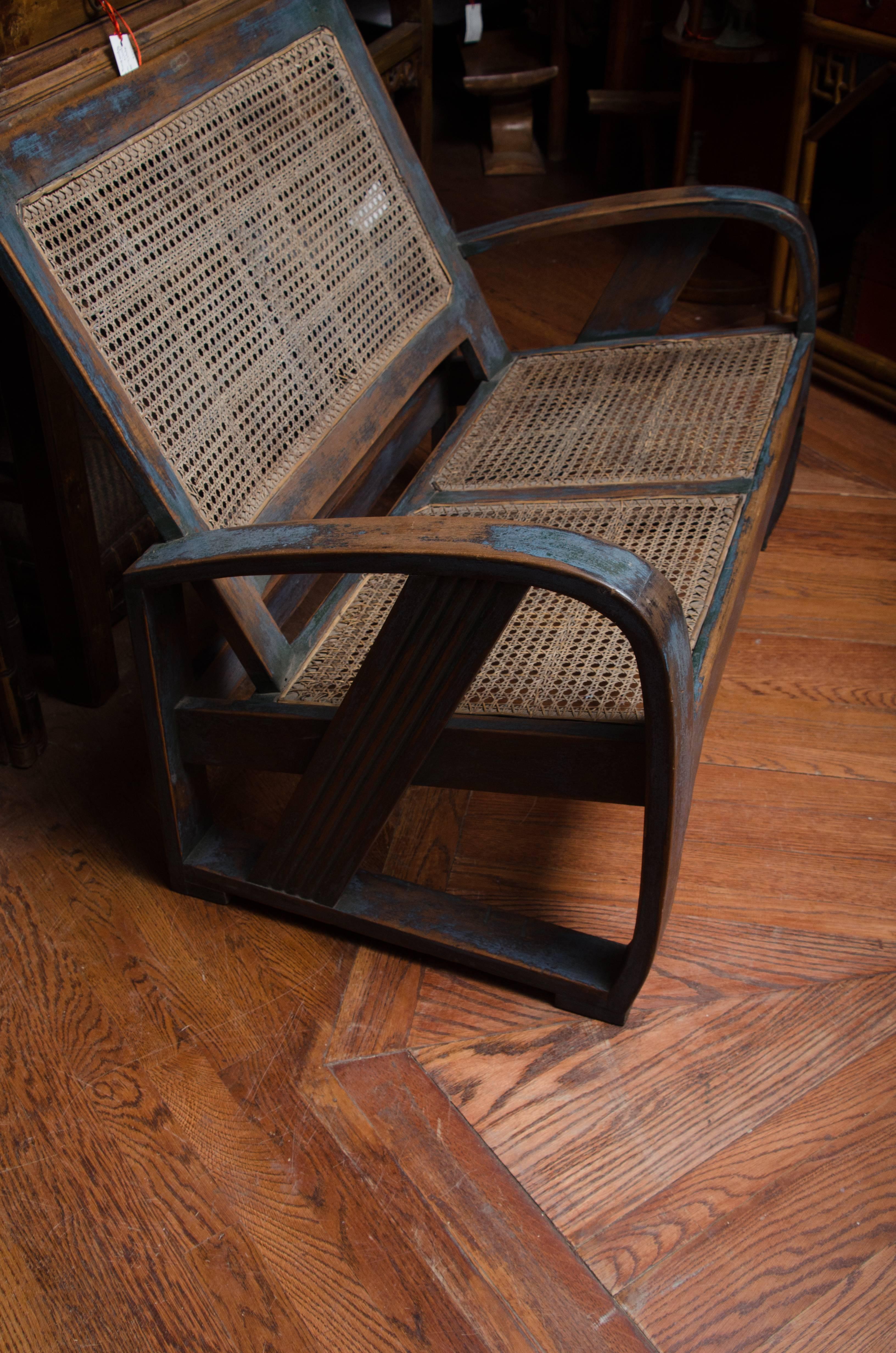 Late 19th century Indonesian Dutch Colonial bench with caned seat and back in original lacquer.