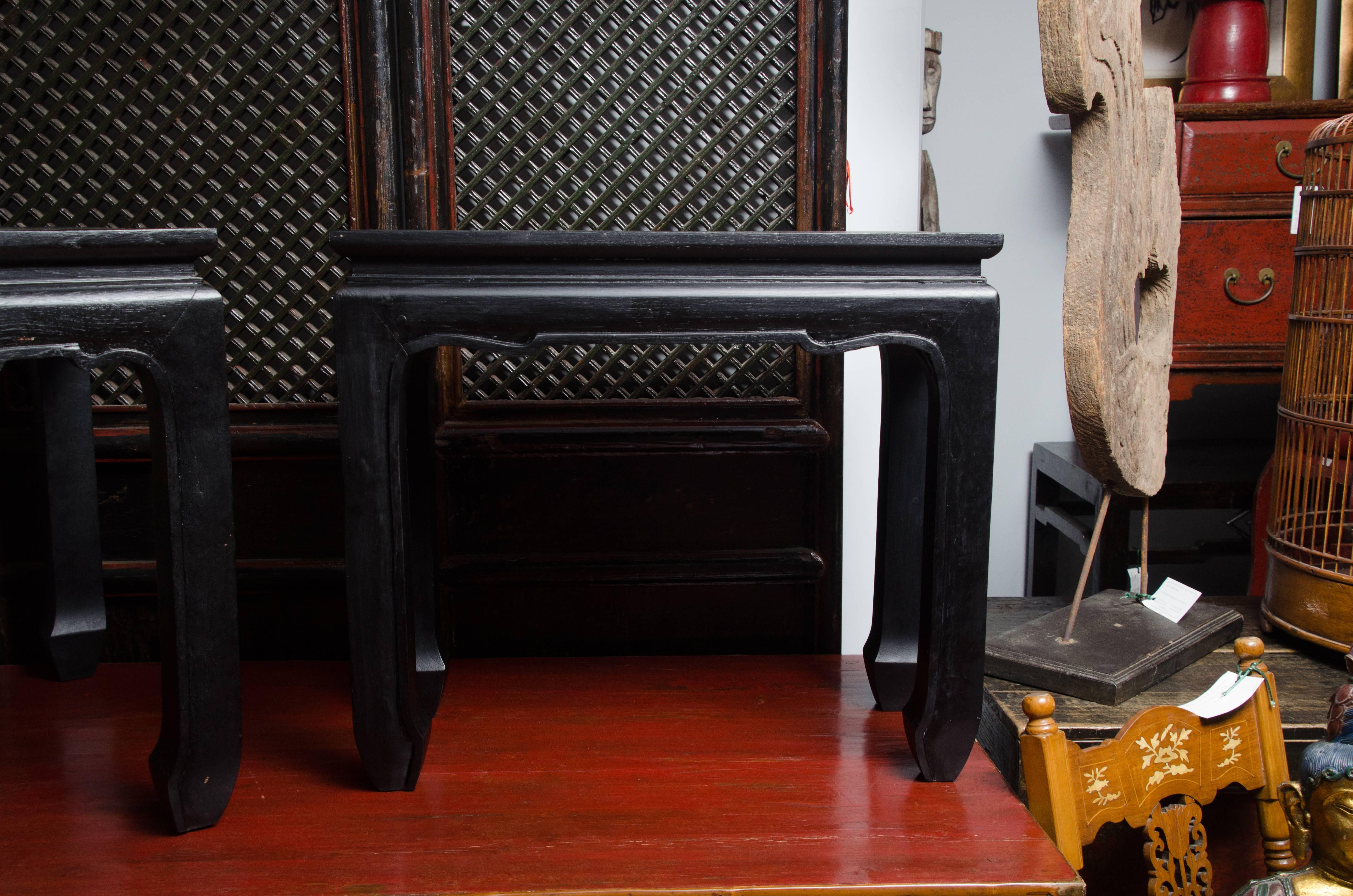 Turn of the century Qing dynasty black lacquered southern elm bench with chow leg (two available, priced and sold separately).