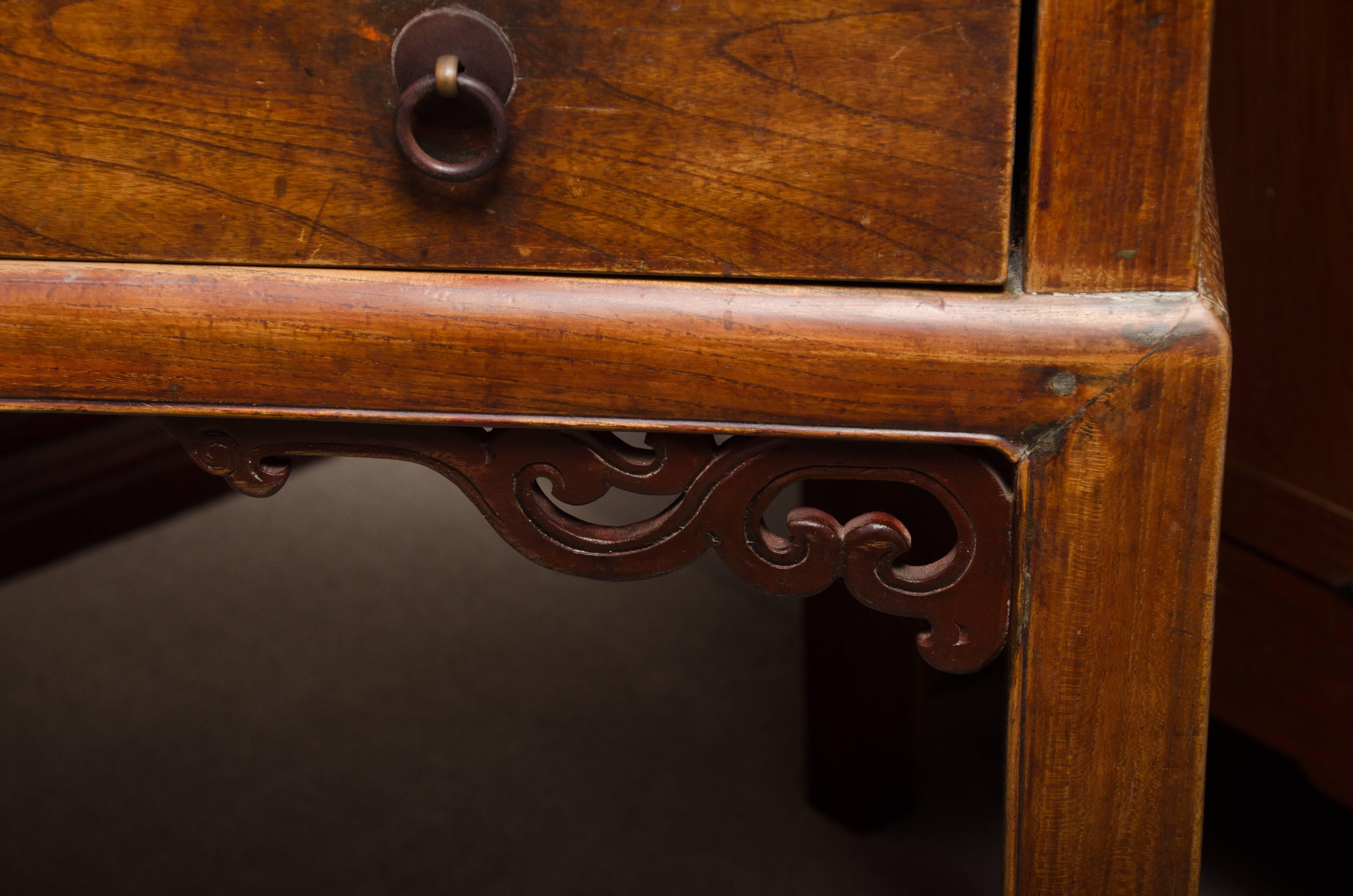 Mid-late 19th century Qing dynasty Southern Chinese elm Ming styled three-drawer writing table with brass hardware.