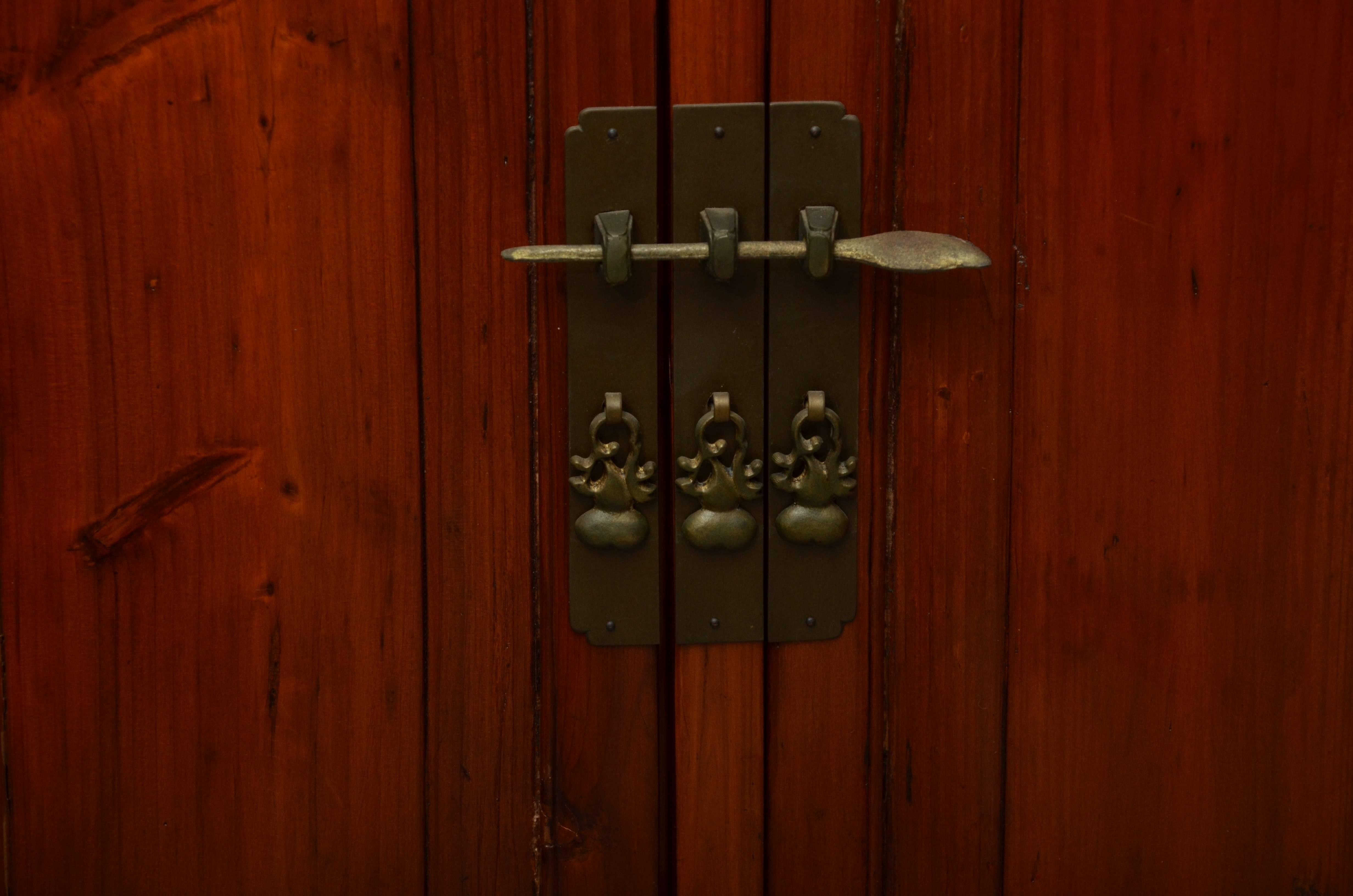 Late 19th century Qing dynasty Ningbo fir wood kitchen cabinet with brass hardware and removable side panels French polished and lacquered.