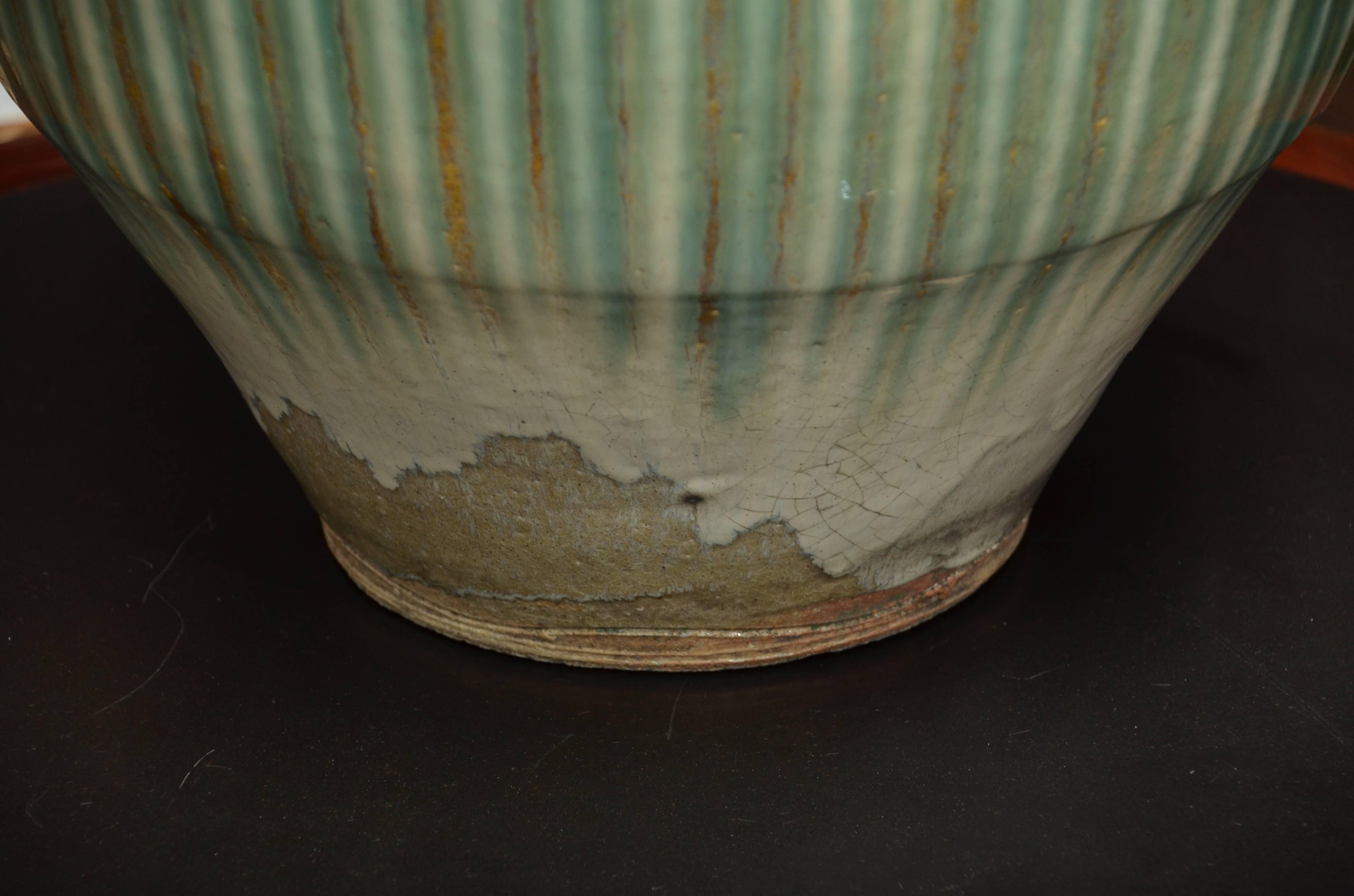 Mid to Late 19th century. Japanese Shigaraki hand thrown fired and glazed water storage urn.