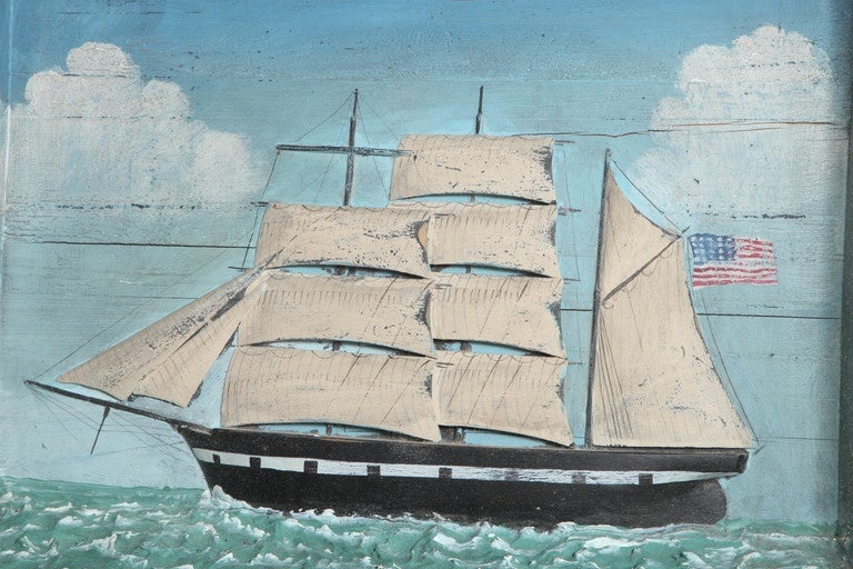 Late 19th century diorama of the three masted black and white clipper ship USS Columbine in full sail in a choppy sea of white-capped grey waves amidst blue skies with billowing white clouds. In original gilt framed glass shadow box.