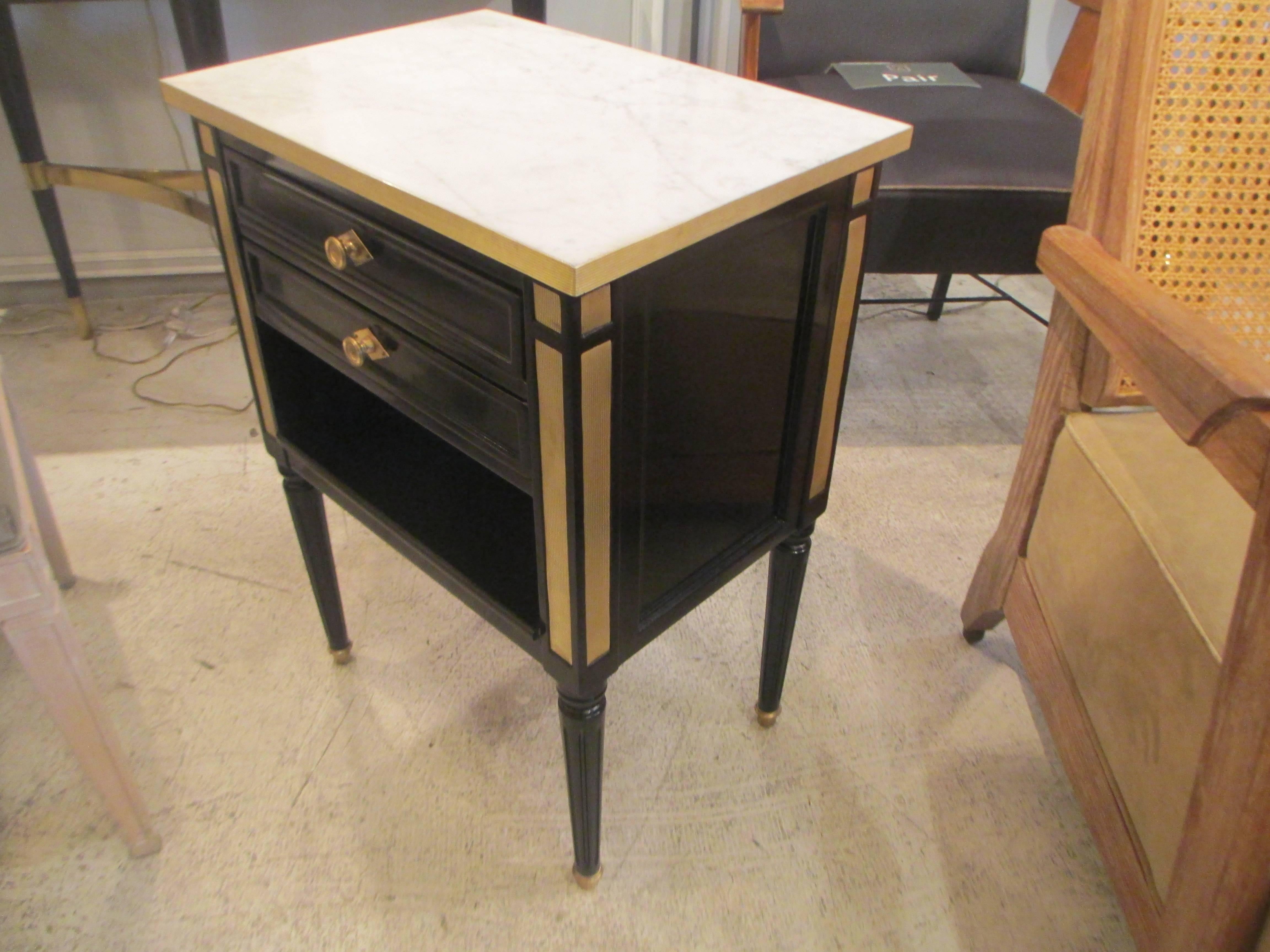 Pair of Ebonized Directoire-Style, Brass-Mounted Nightstands With Marble Top on Tapered Legs Ending in Brass Sabots