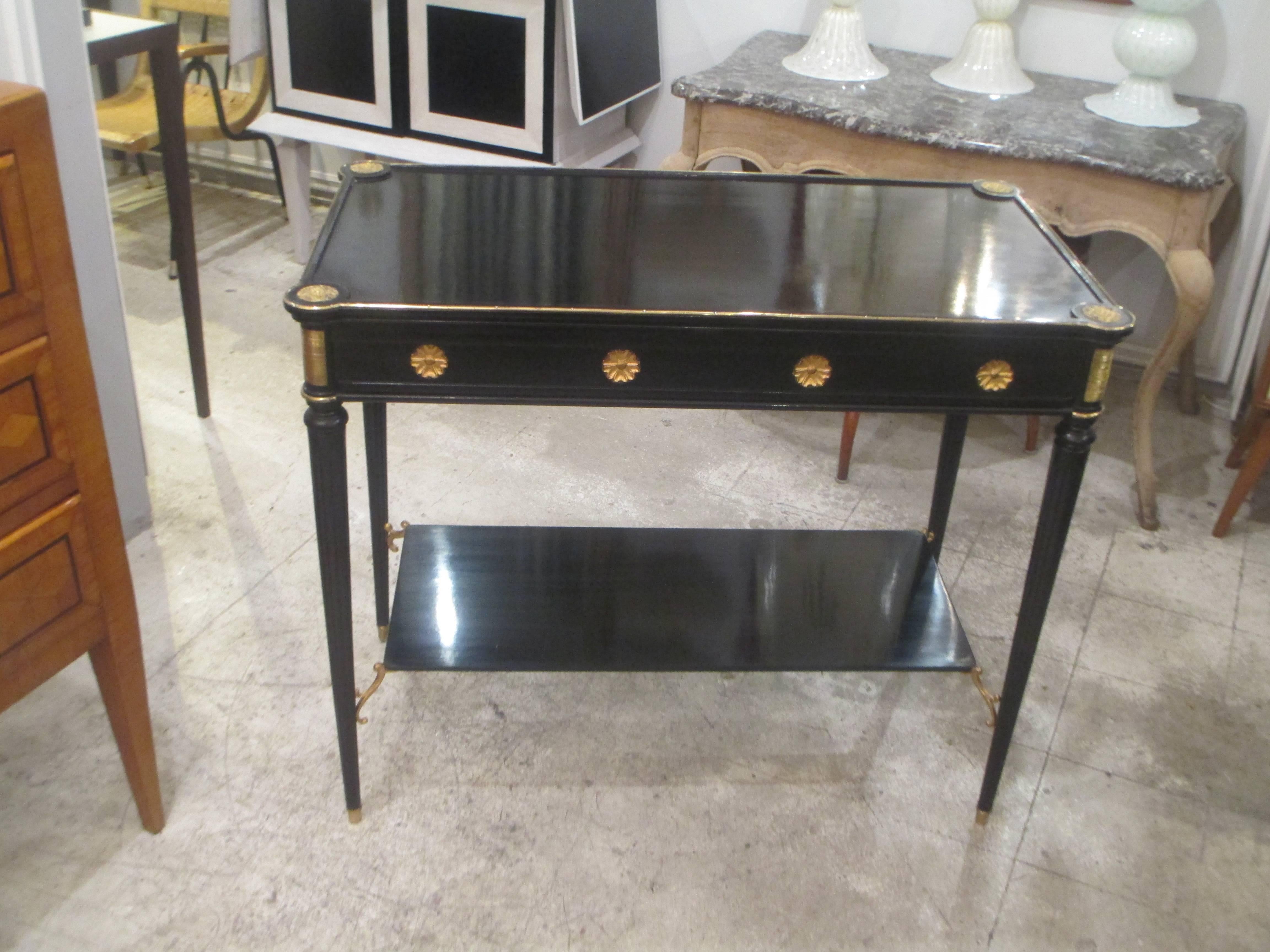 Maison Jansen bronze-mounted server in the Directoire manner with shelf on tapered legs ending in brass sabots.