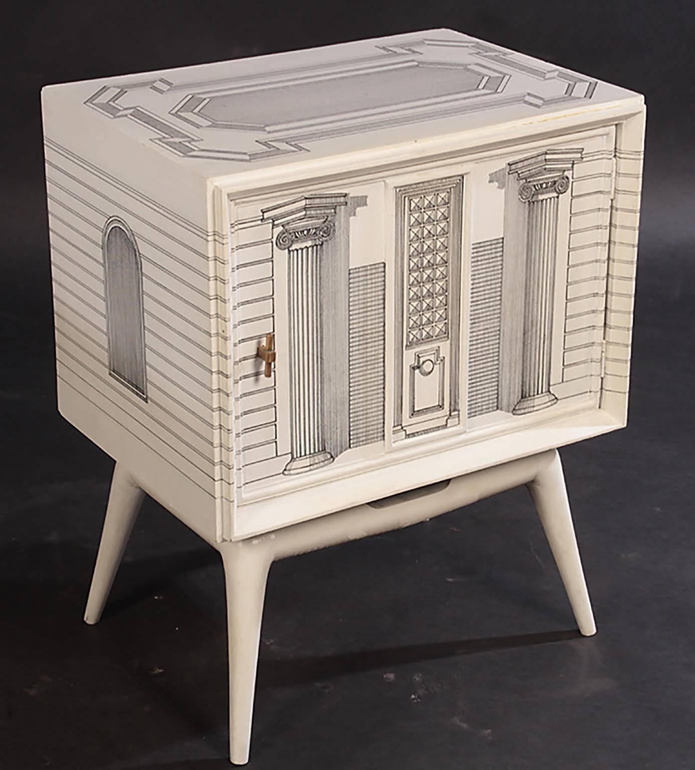 A pair of midcentury hand painted architectural end tables in the manner of Fornasetti.