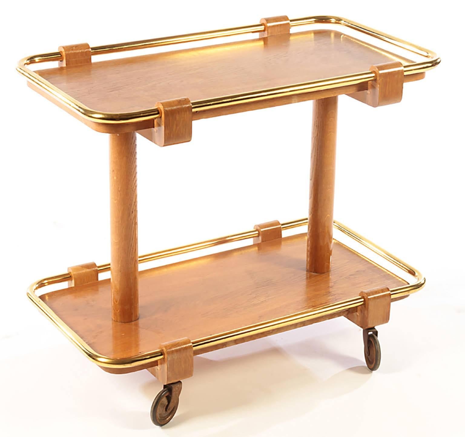 Sculptural Mid-Century Modern walnut and brass two-tiered drinks cart or bar cart.