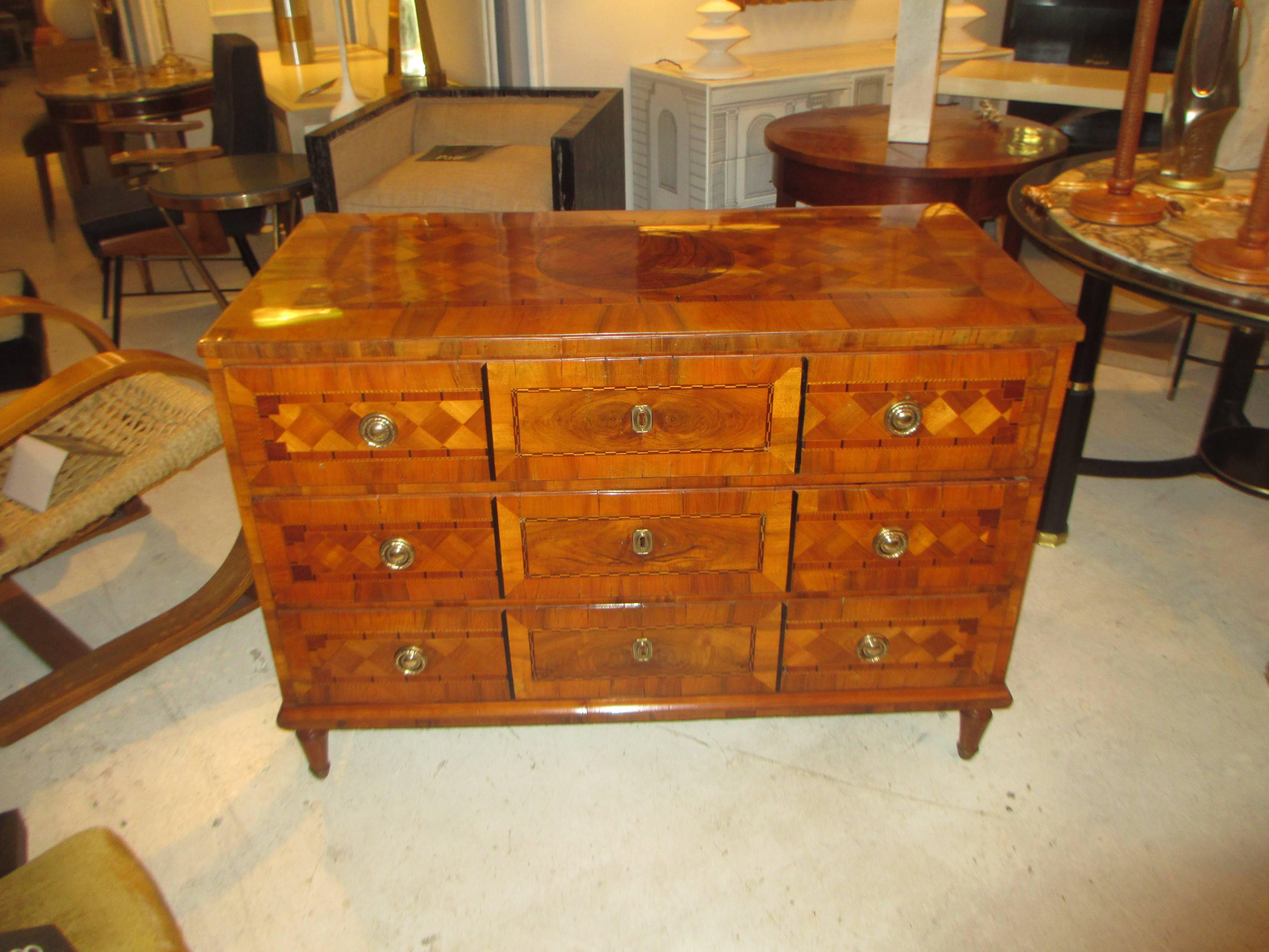 Antique  Neapolitan Parquetry Commode With Three Central Drawers. The Exquisite Geometric  Parquetry Inlay Consisting of Walnut, Mahogany, Rosewood, Ebony among other types of woods