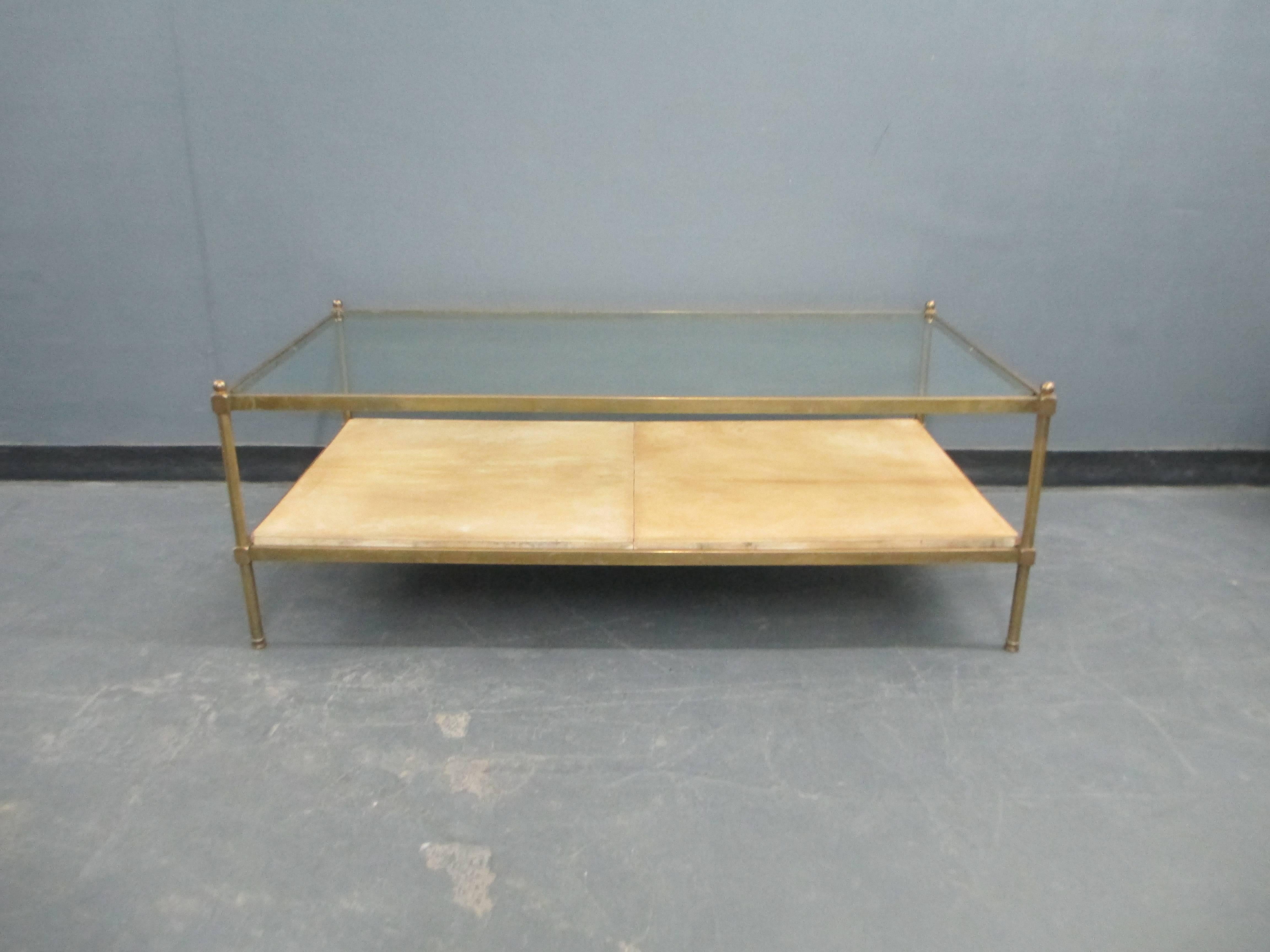 Two-Tiered bronze coffee table with parchment shelf.