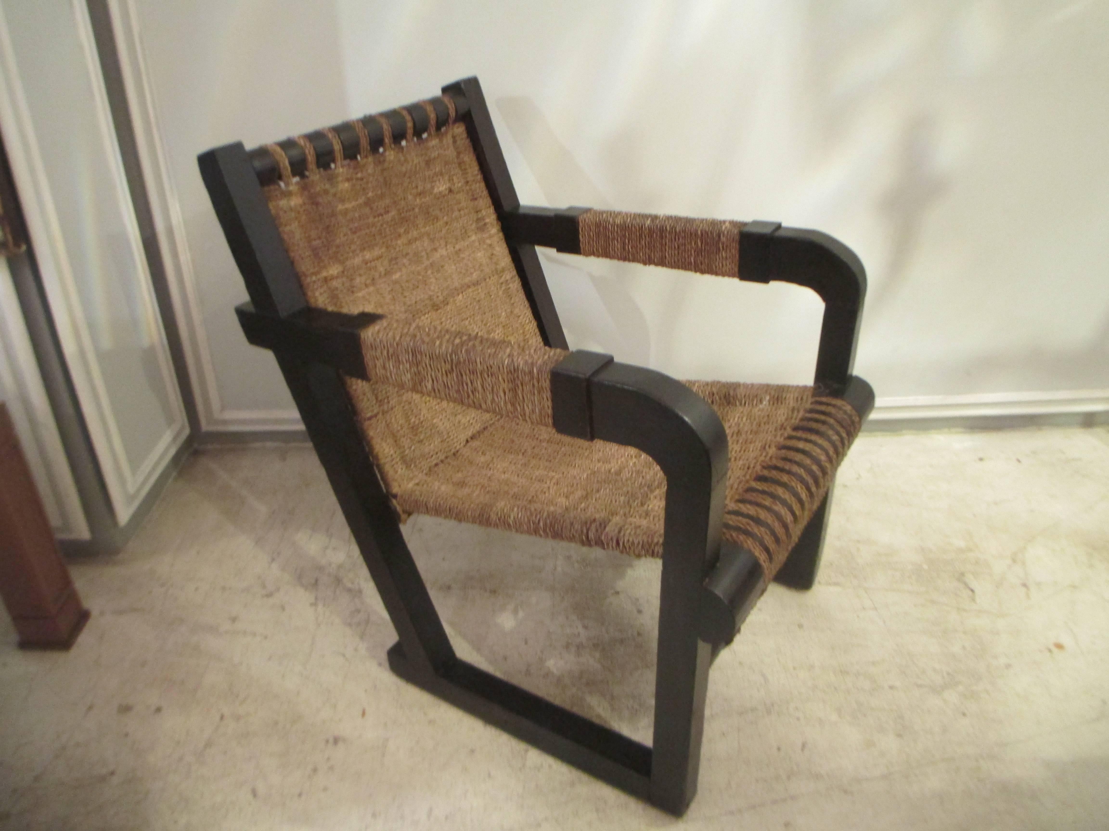 A pair of French 1920s caned lounge chairs. These chairs are extremely comfortable.