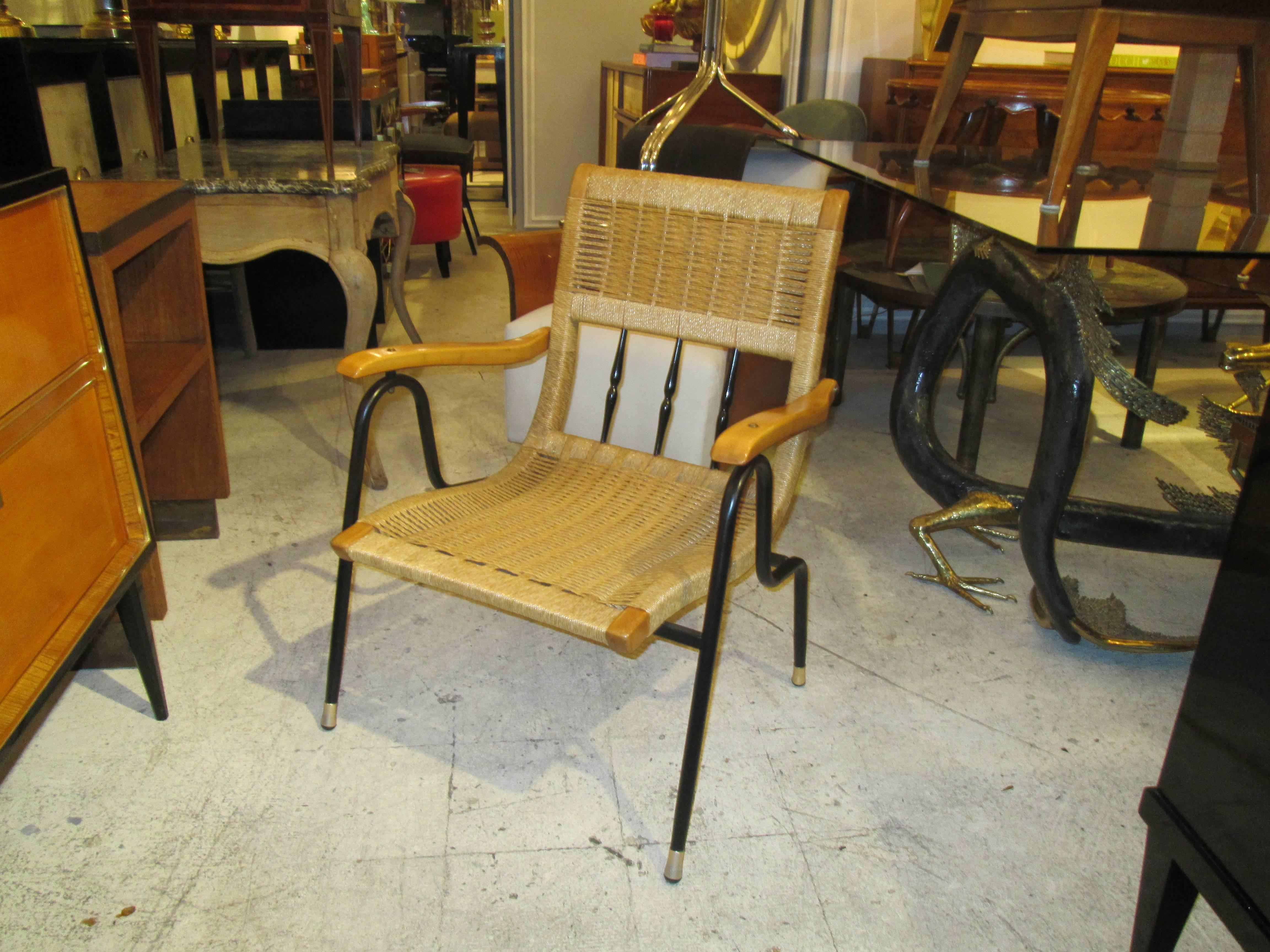 A pair of Mid-Century Italian rattan and iron armchairs.