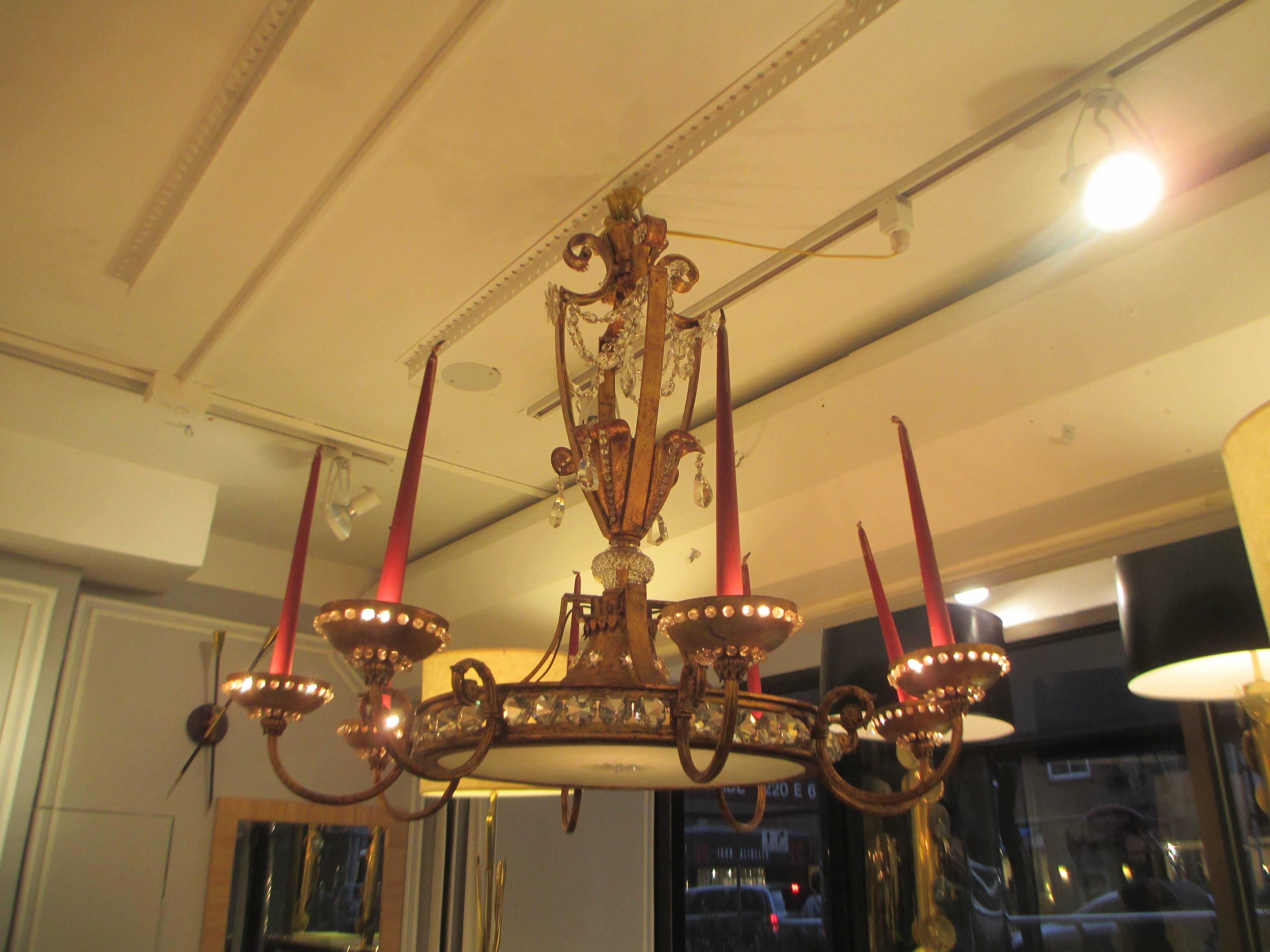 Exceptional Bagues gilt-iron and crystal chandelier with eight arms.