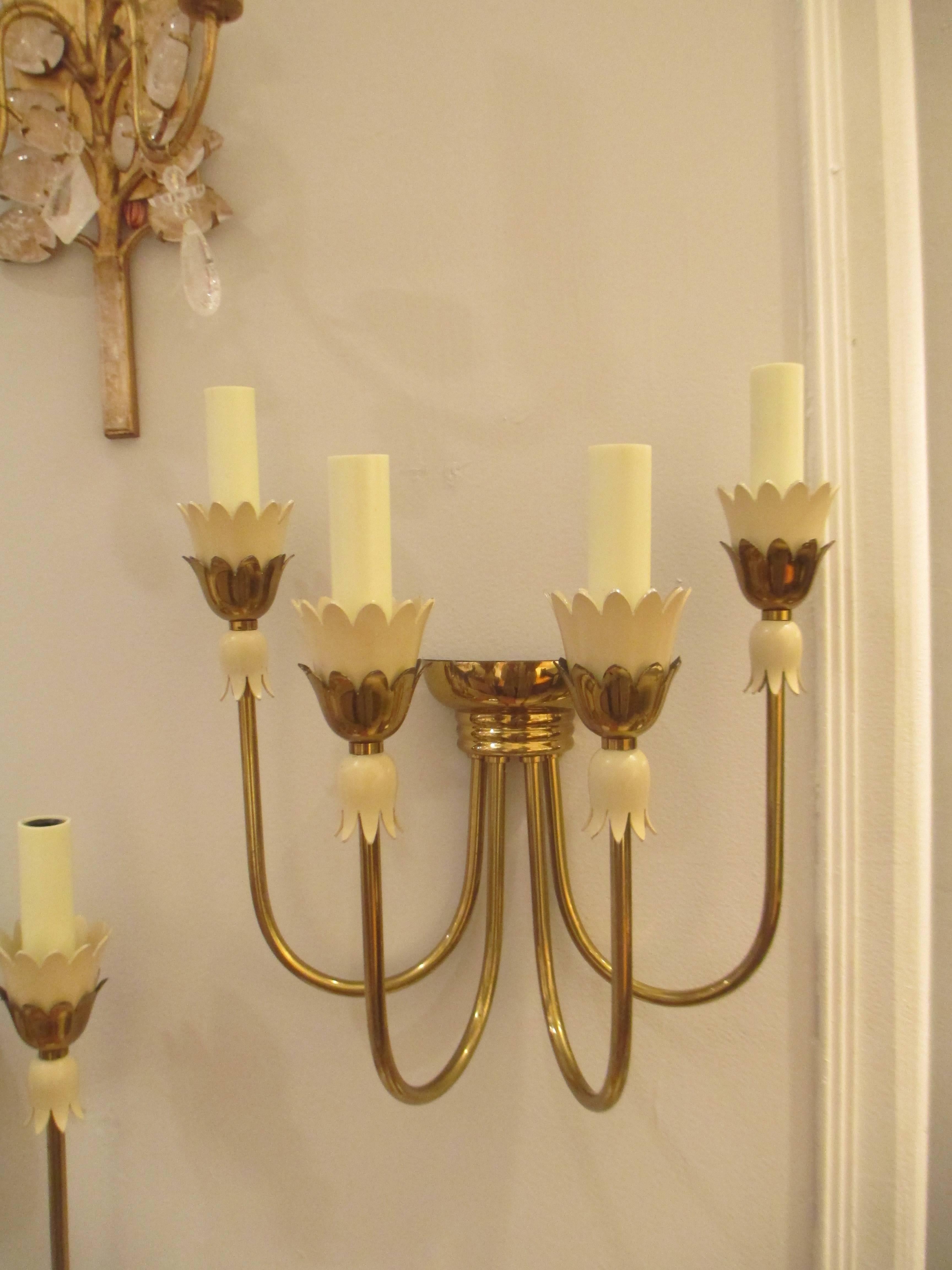 A pair of Mid-Century Italian tulip motif brass sconces with four arms.