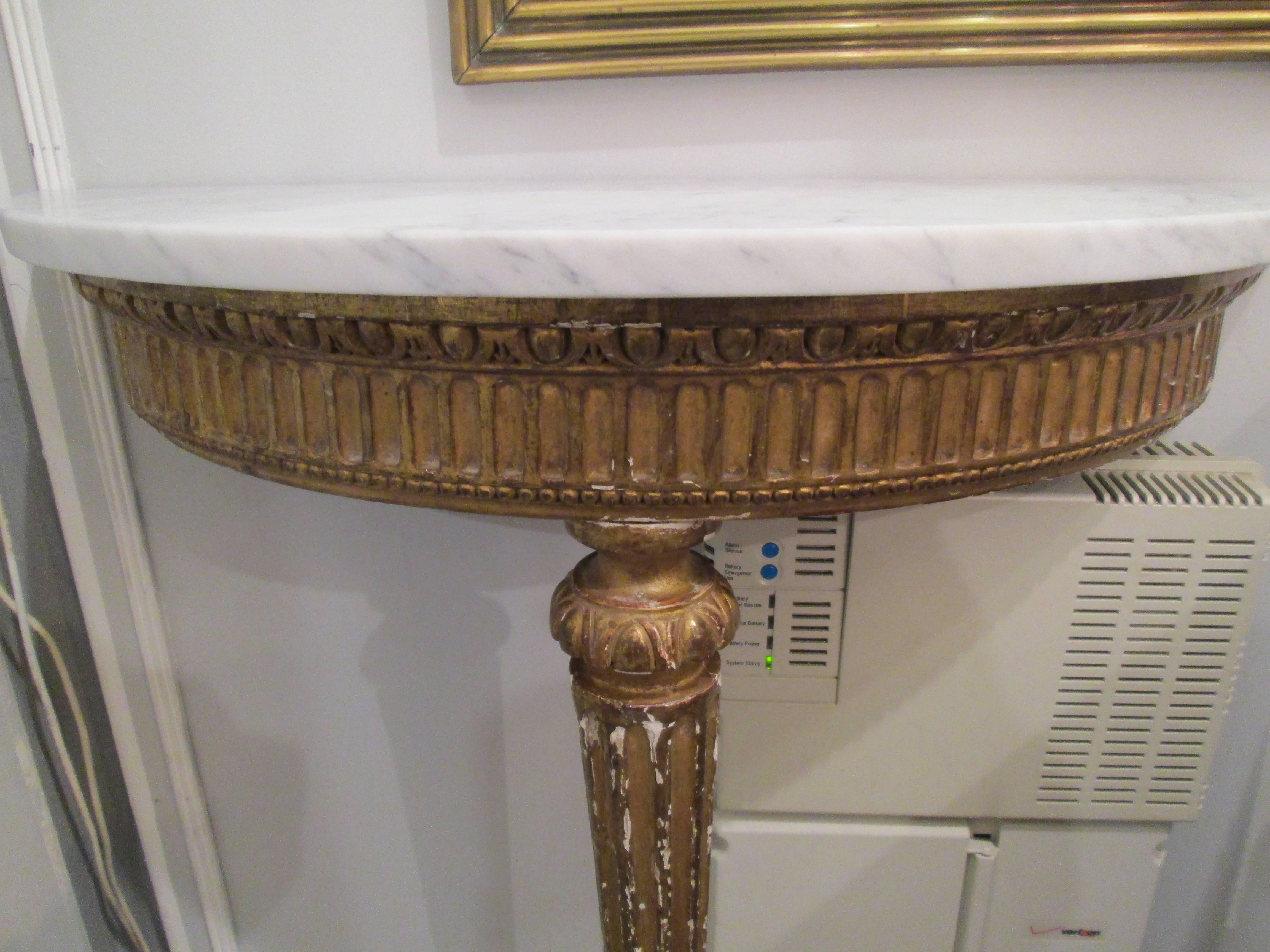 Antique French giltwood marble-top demilune console.