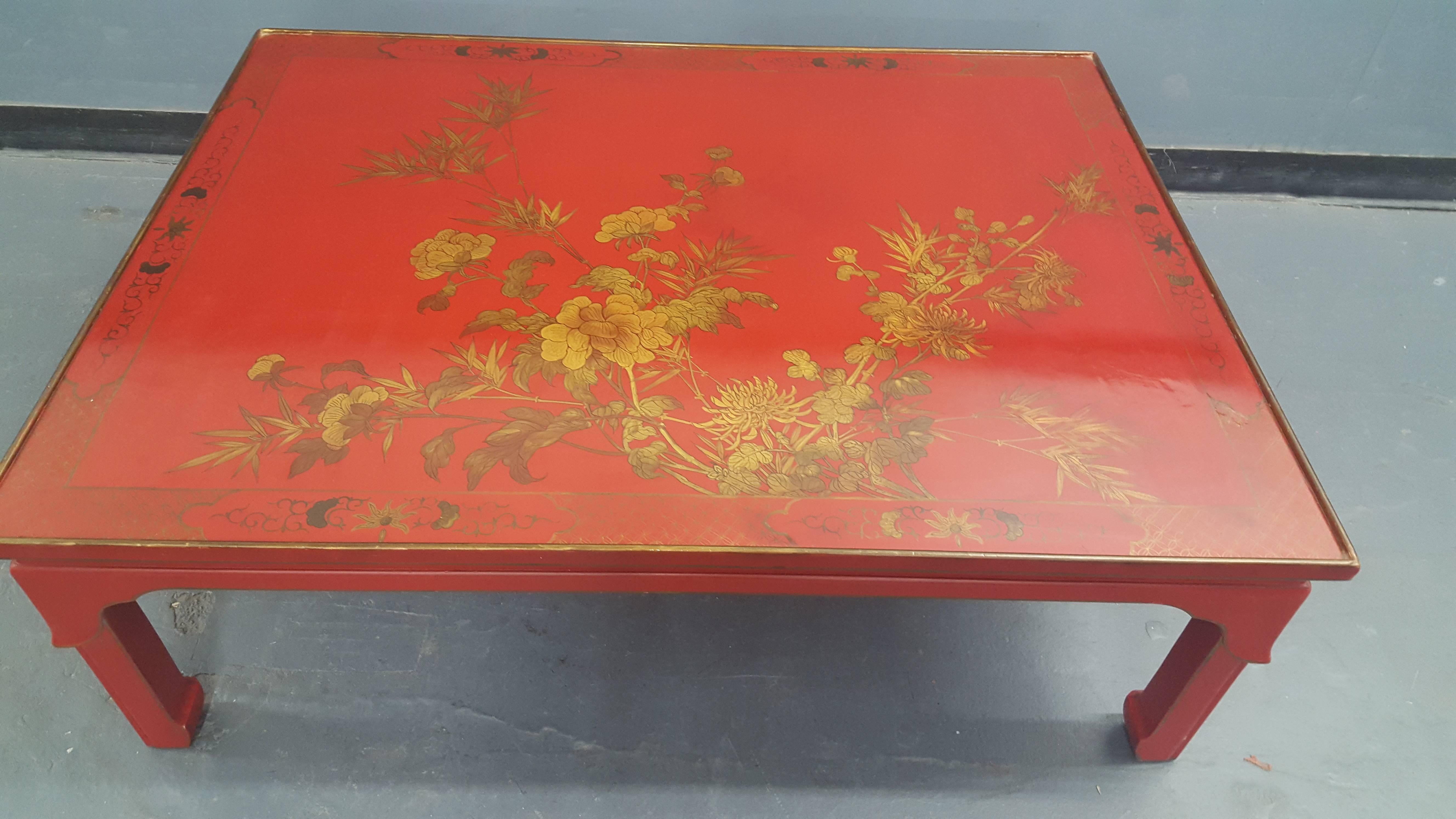 Red lacquered chinoiserie coffee table with hand-painted top.