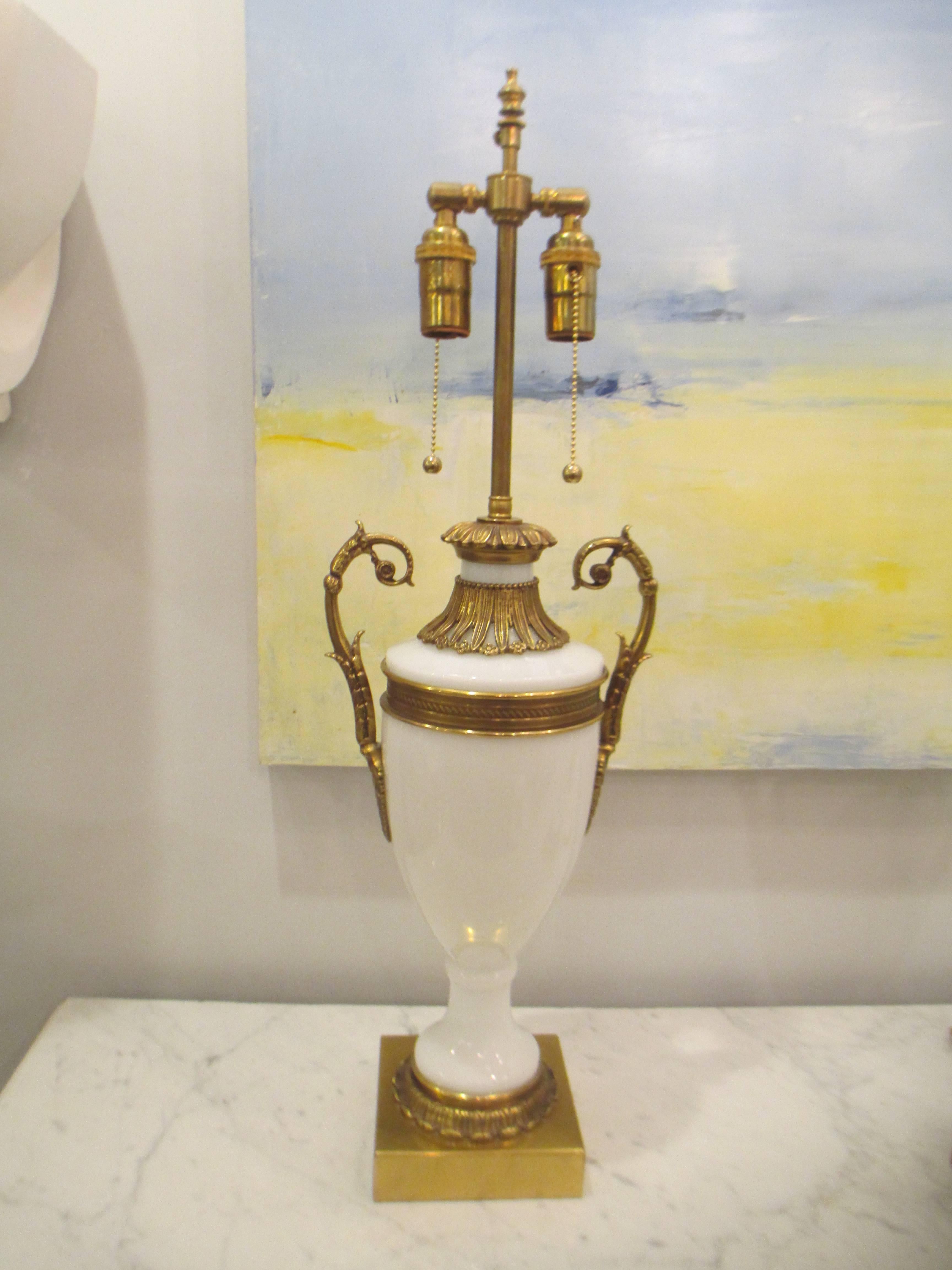 Pair of French opaline glass, bronze-mounted lamps in the neoclassical manner.