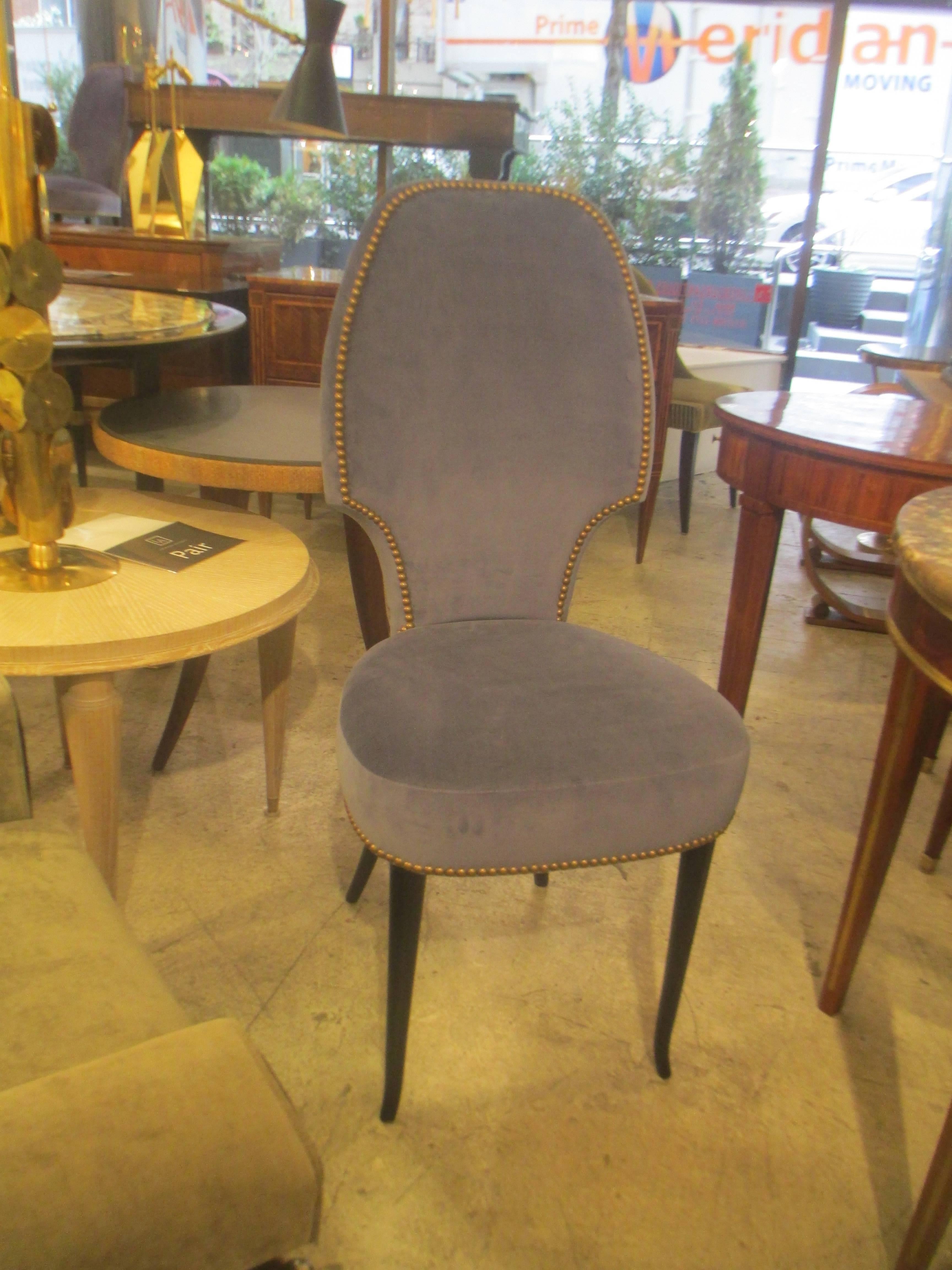 Set of six Italian midcentury sculptural Italian dining room chairs on ebonized legs, hind legs are slightly splayed. Chairs are upholstered in velvet with added nailheads, extremely comfortable.