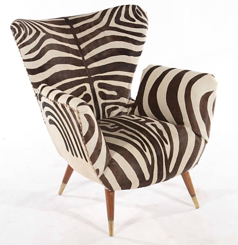 A pair of Italian Mid-Century lounge chairs upholstered in leather with a zebra design.