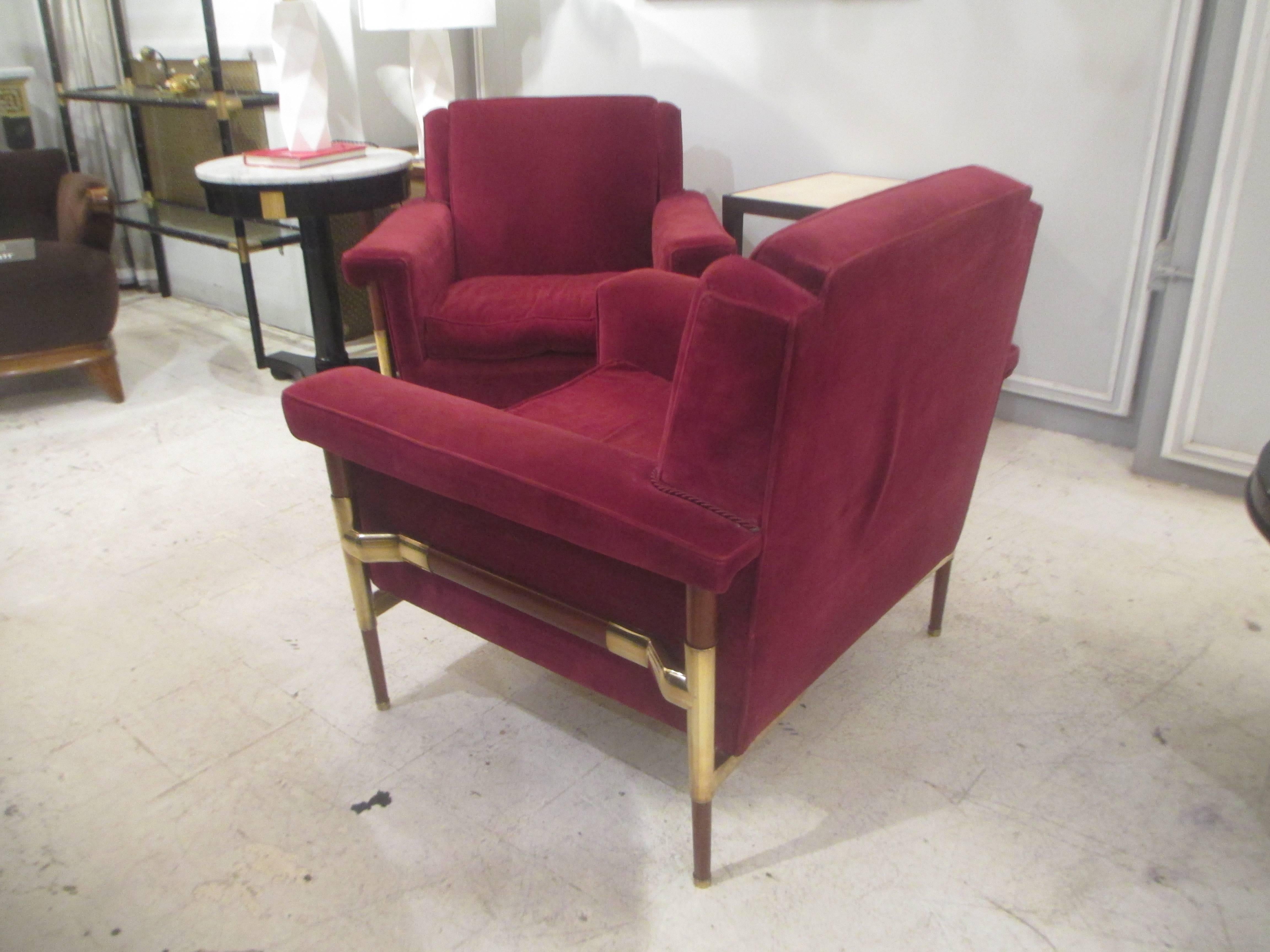 An unusual pair of brass-mounted midcentury Italian walnut lounge chairs.