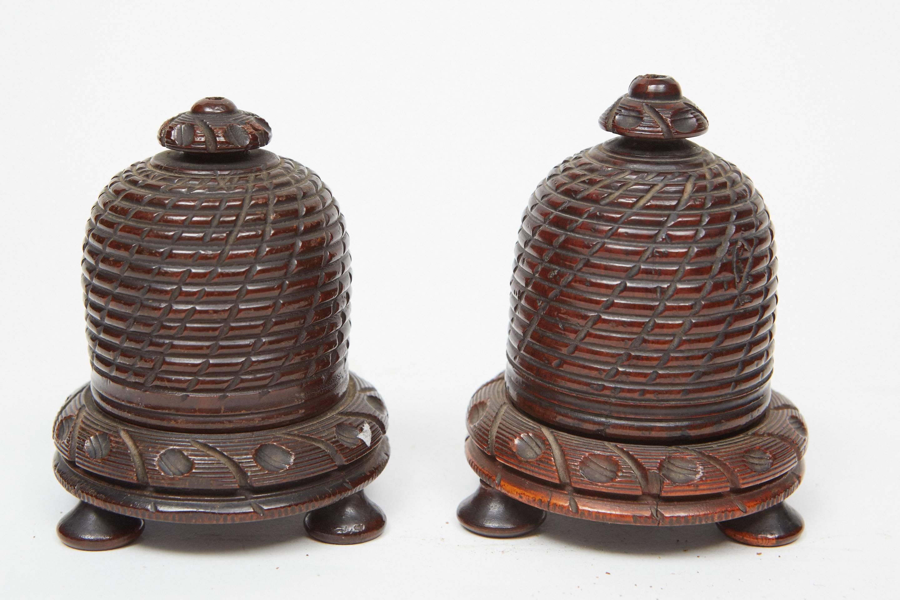 These beautiful 19th century hand-carved beehives have wonderful details throughout. They were made to store balls of string that would be pulled up through the hole in the top. They are priced per piece and are slightly different sizes, see