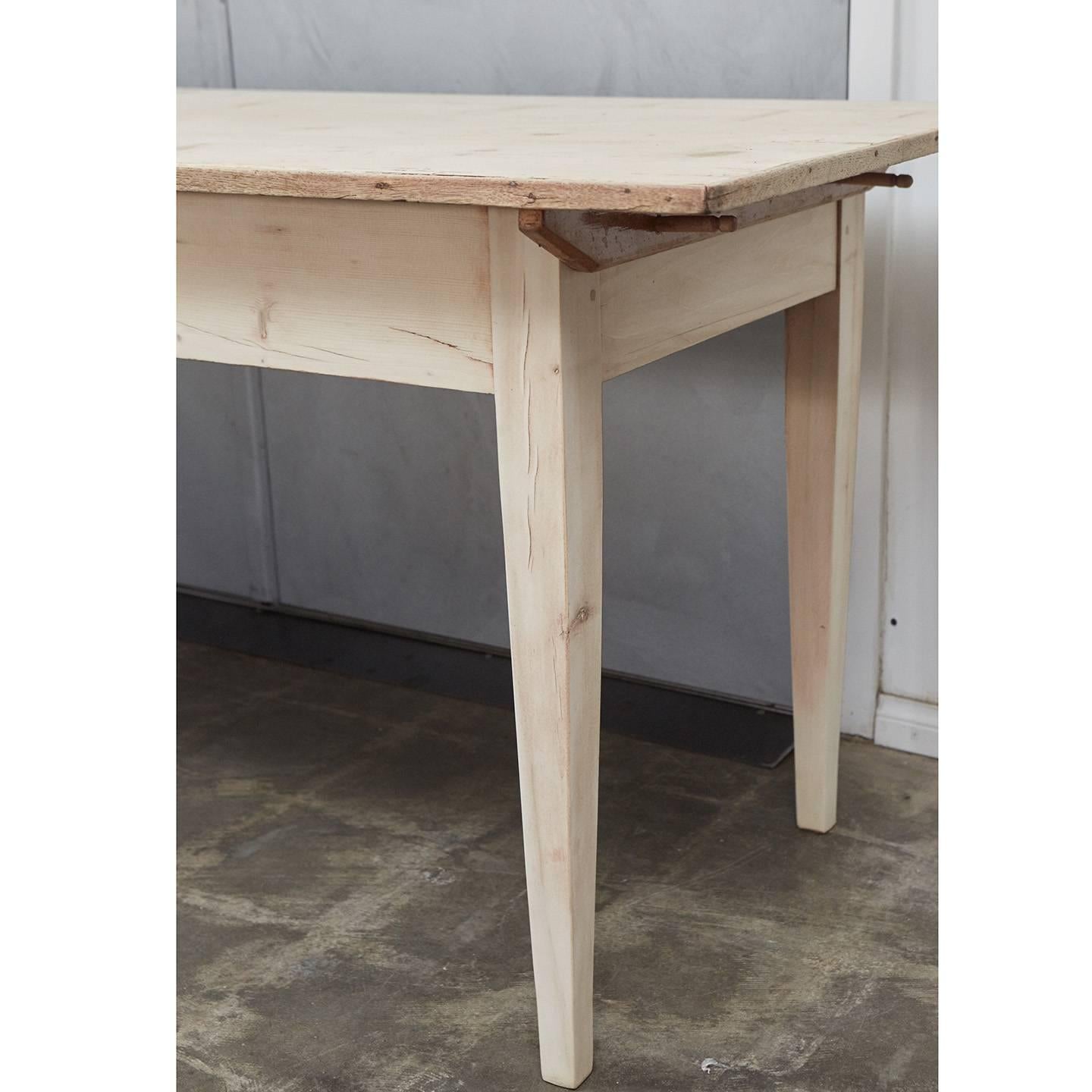 This fine country farm table with bleached wood finish is well suited for a variety of uses. Measure: The table has a three board top, 6