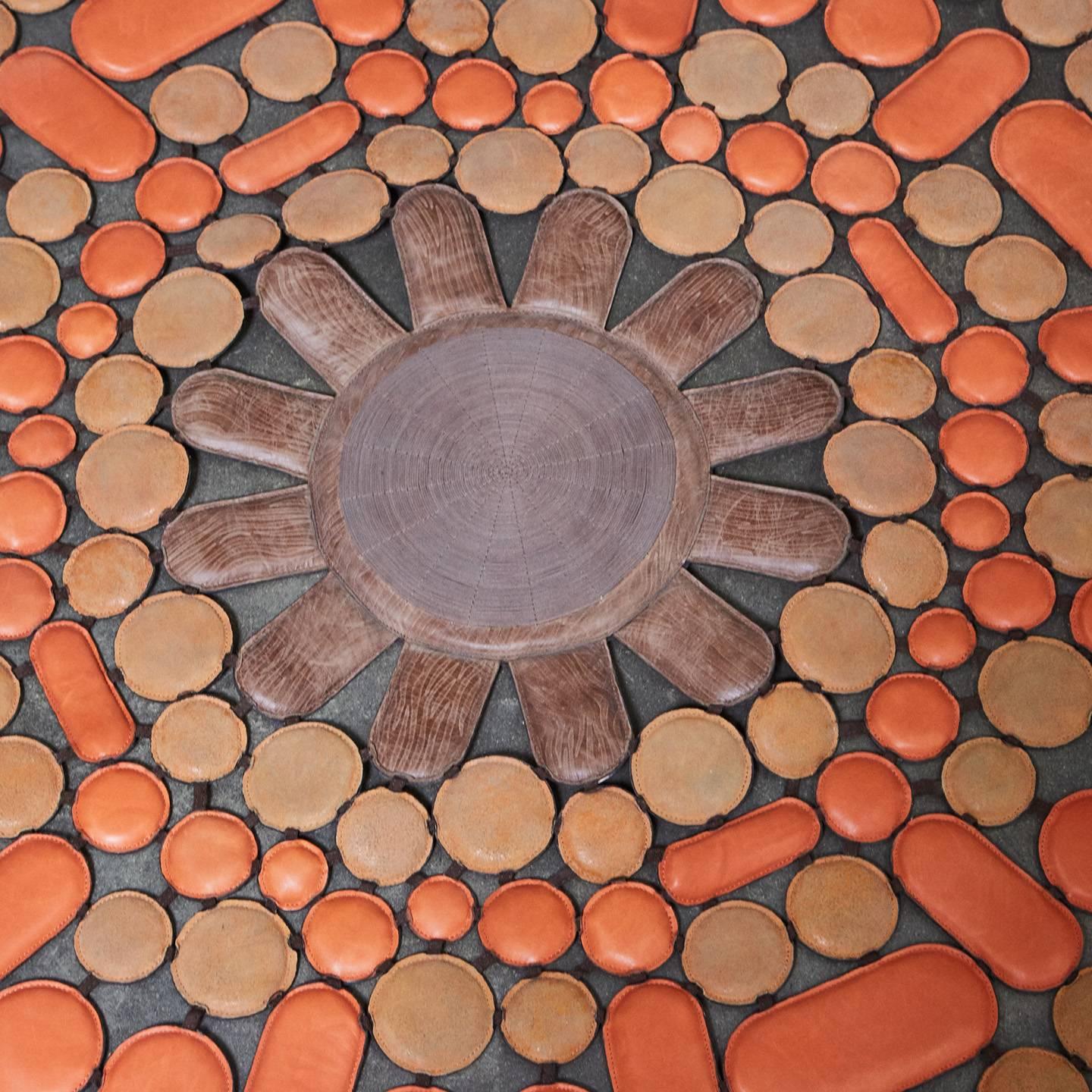 This beautifully made leather rug comes from the Italian company, Pechama from their 'Living' collection. It is called Sunshine Orange and is made with leather pads attached in a concentric pattern with a decorative core. This piece came to us after