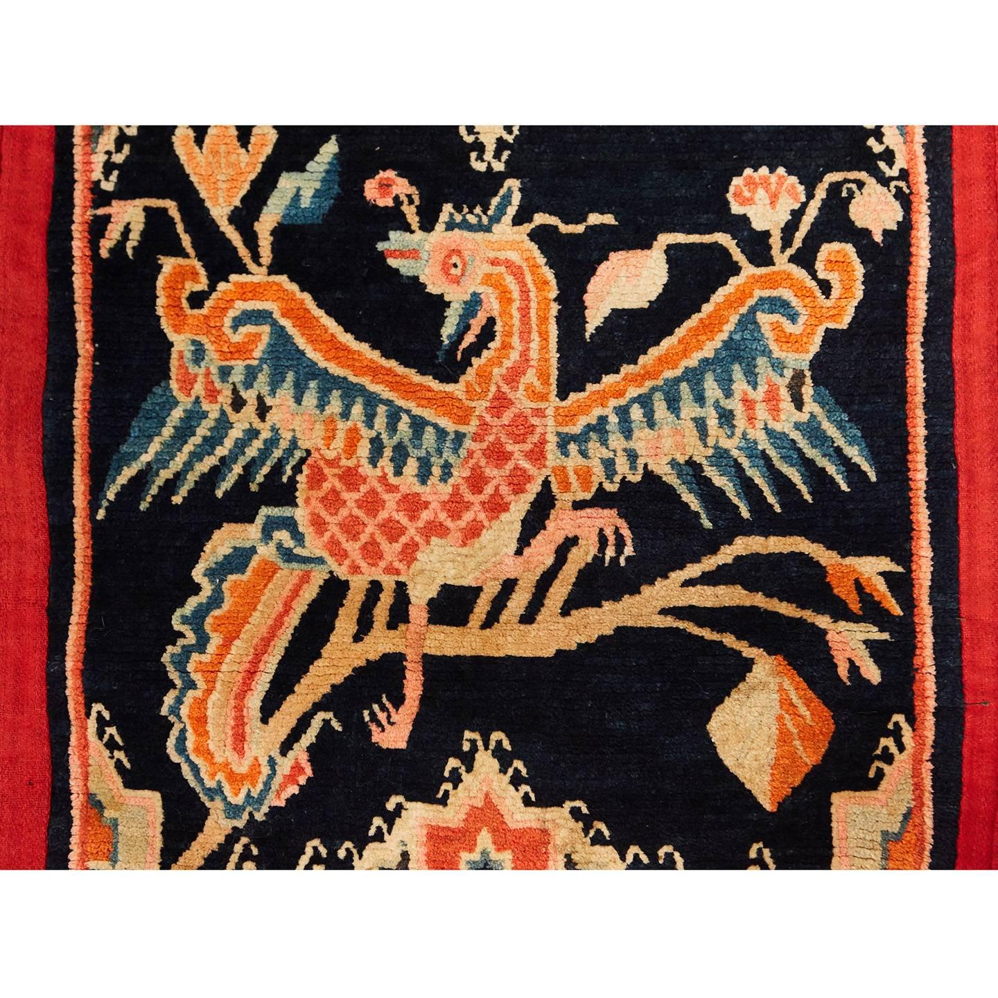 This handwoven wool saddle cover features ornate traditional Tibetan motifs in a vibrant palette. Originally woven as a protective covering for a horse, Tibetan saddle blankets are a relic of a time when art and utility were one in the same.