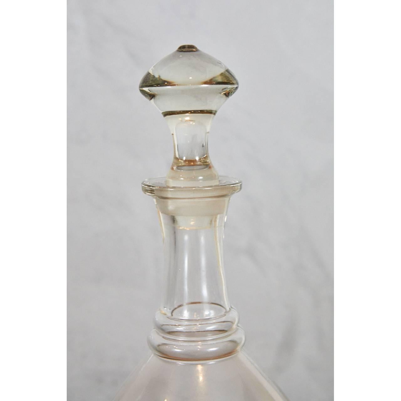 This exquisite glass apothecary bottle has a separate base and bottle that fit snugly together. The beautifully stopper measures 4.5