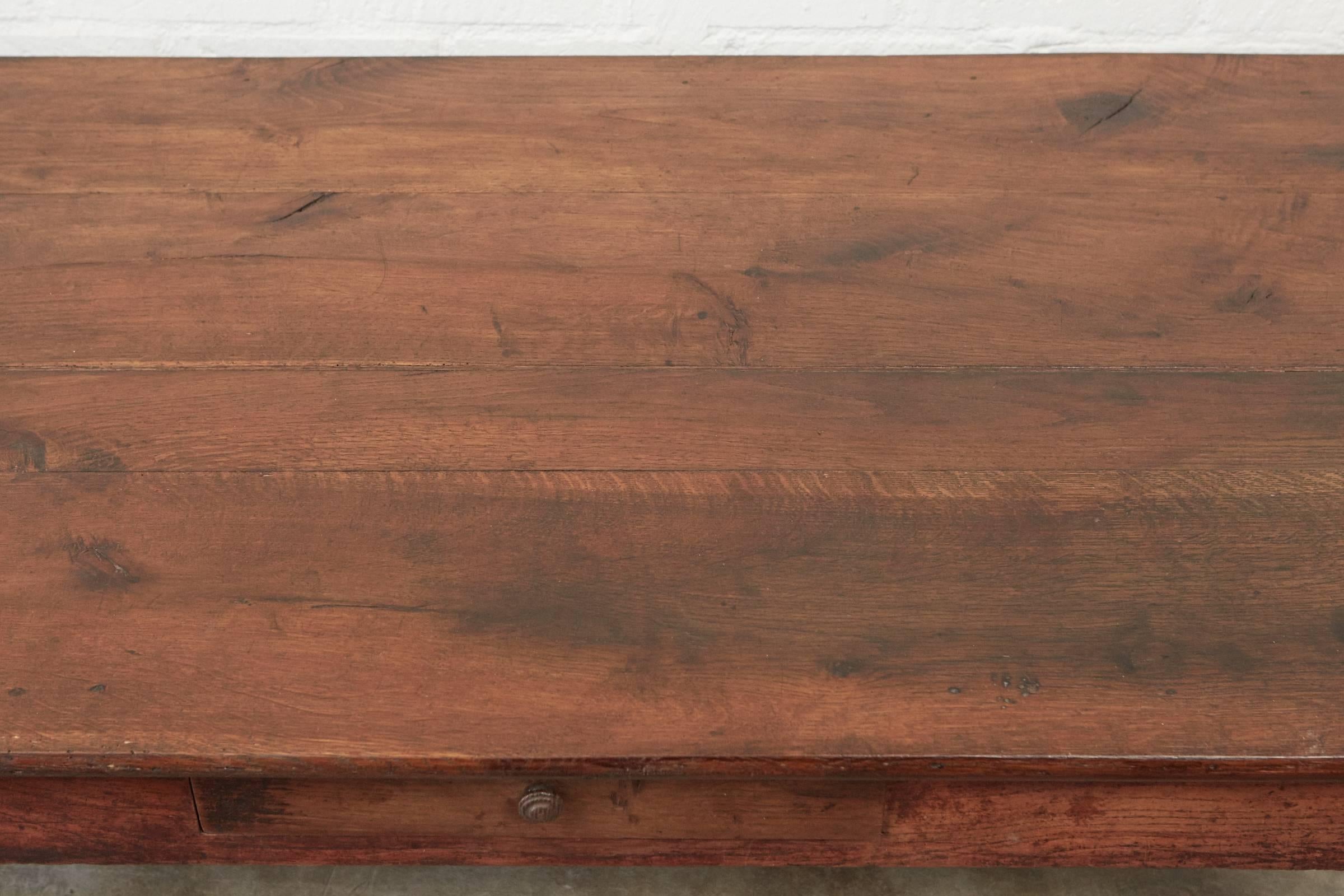 This gorgeous coffee table is made of pine and oak using antique joinery and pegged construction techniques. It has nicely tapered legs and one drawer that has a turned wooden knob. 

 