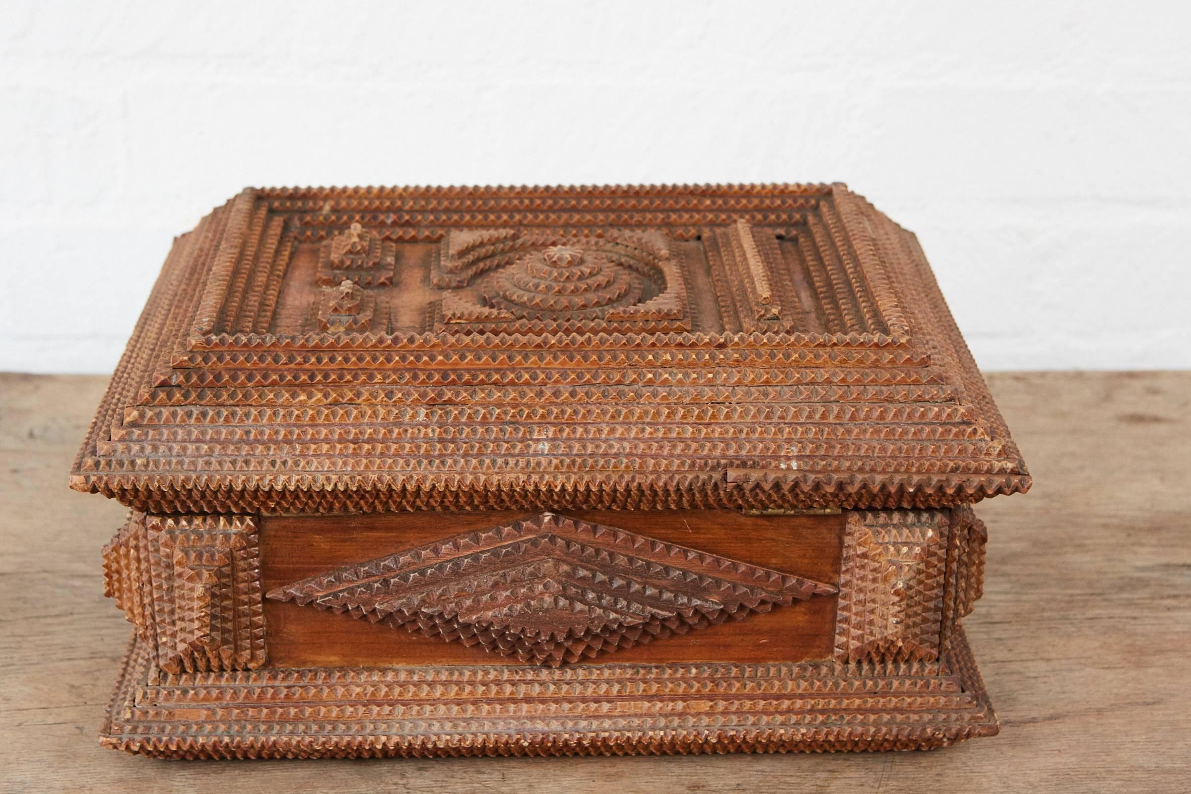 This interesting tramp art box is of a nice size with multiple geometric layers in various designs made of hand cut cigar box wood. The interior is lined with hand printed Japanese paper.
     
     