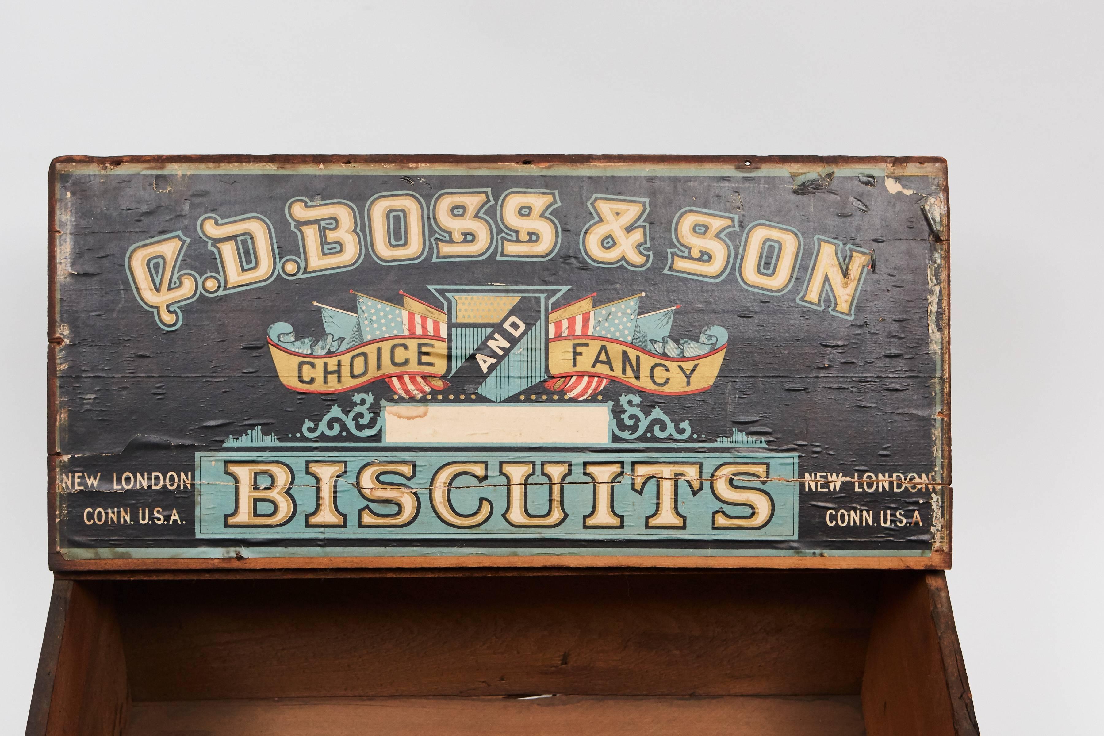 This store display Biscuit Box has great character and charm. The paper printed labels are both in good condition with very little fading or losses, and the label on the inside of the lid retains great original color. The labels read: "C.D.