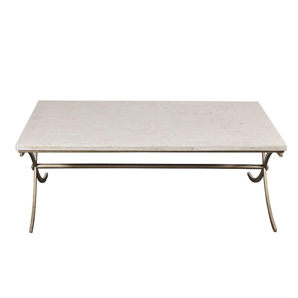 This travertine stone table has an iron base with a nice finish in a matte metallic color. The base is in the shape two stylized X's with a single pole for a stretcher.