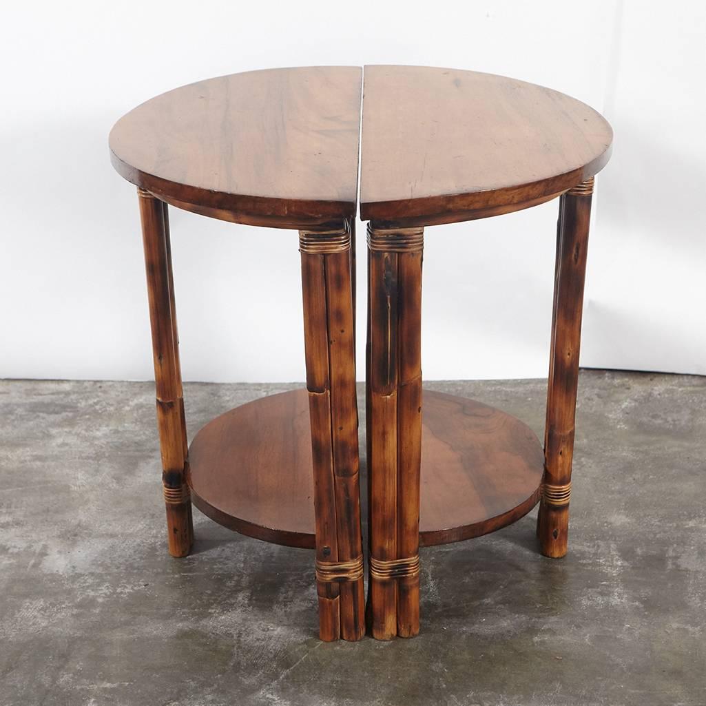 These small-scale side tables work separately as demilunes or together as a small circular coffee table. Each table has walnut tops and shelves rattan legs that are bound with split reed. The legs have been finished in the tiger bamboo manner adding