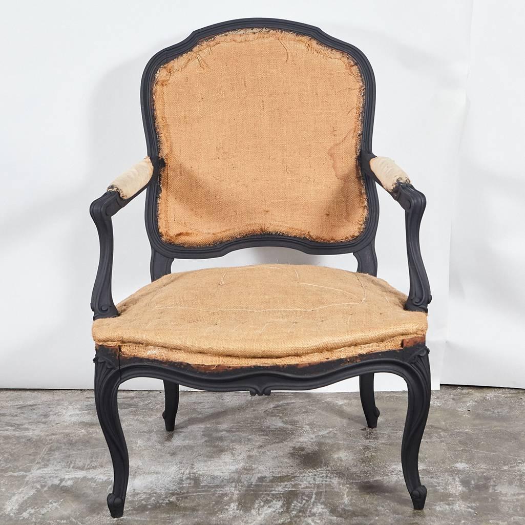 These Louie XV style chairs have been painted matte black for an updated look. The chairs have a nice wide seat and are well built with simple carved details. We went ahead and brought them down to the burlap foundation, so they are ready for