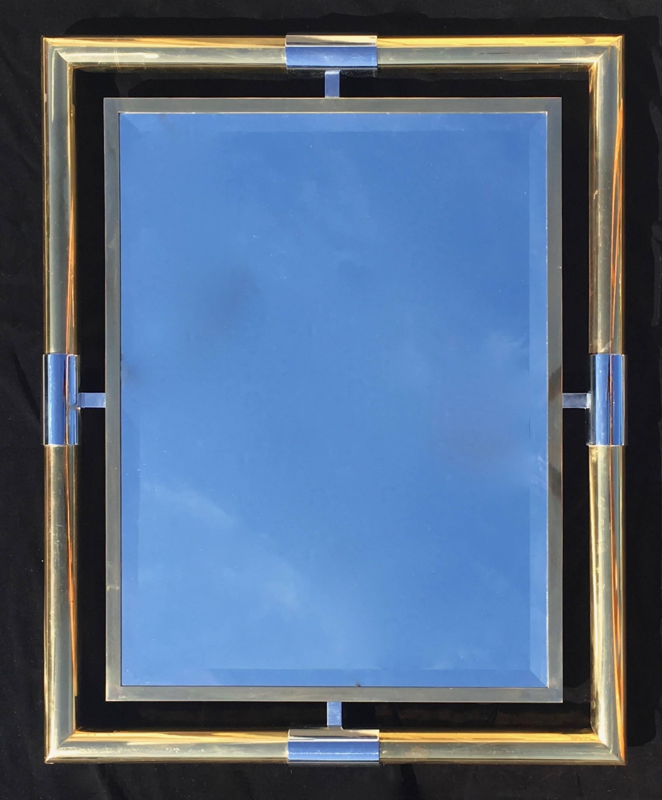 Mirror,
France,
1970s.
Tubular brass frame, steel supports, interior brass frame, beveled glass.
Measures: 100 cm x 80 cm x 5 cm.
 