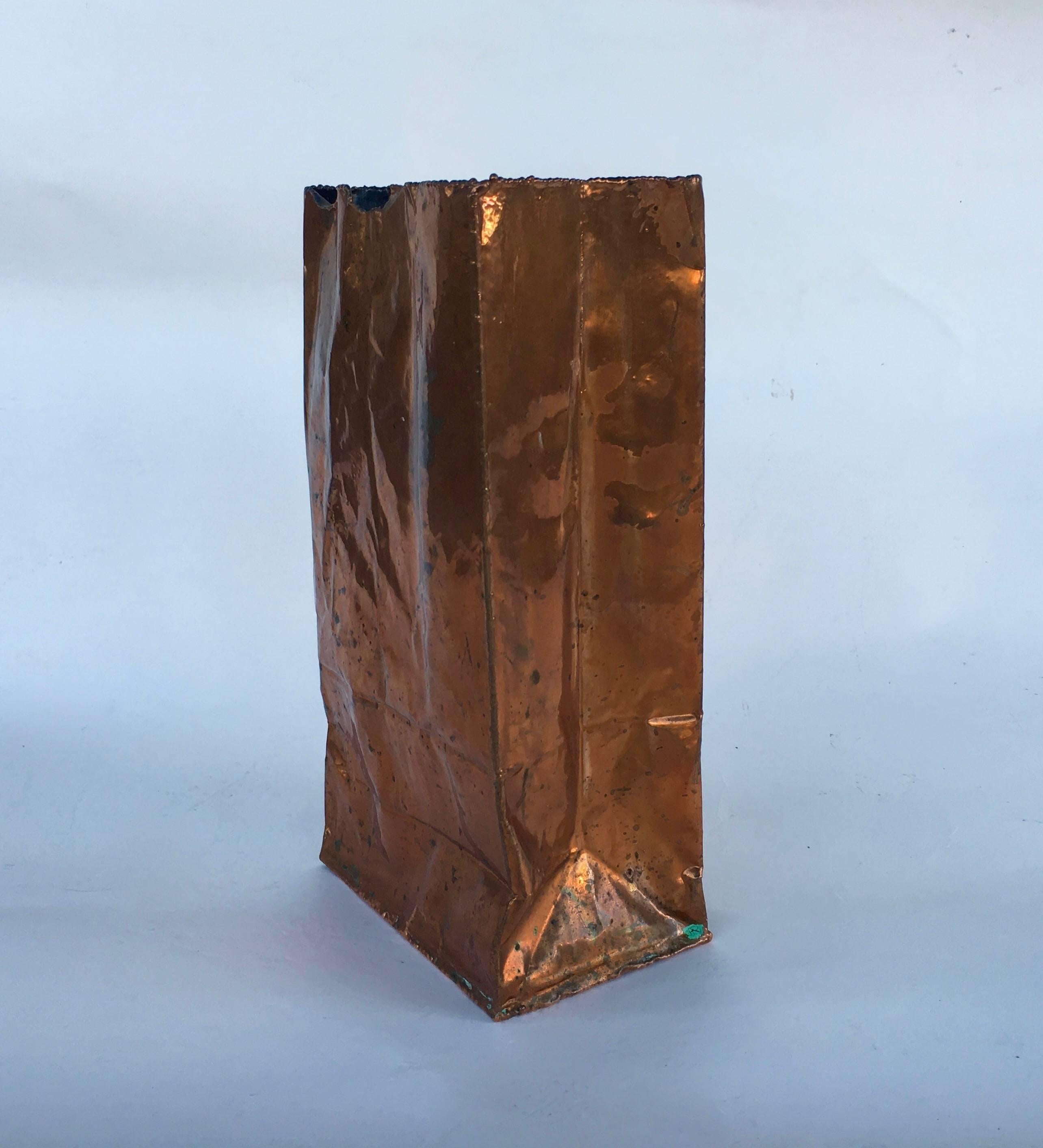 Kelly Wearstler.
Bronze bag,
2013.
Cast bronze, matte rose patina.
Measure: 10.75 x 5.25 x 3.5 inches.
California Bronze label underneath.

Kelly Wearstler is a Los Angeles based designer.