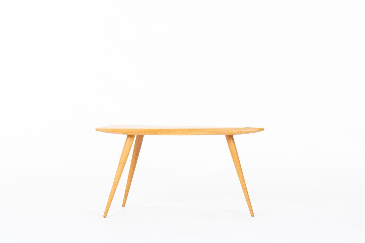 Add a touch of refined simplicity to your space with the “Model 44” coffee table by French designer Pierre Cruège, a beautifully understated piece from the 1950s.
Crafted in solid oak, this three-legged table reflects the clean lines and quiet