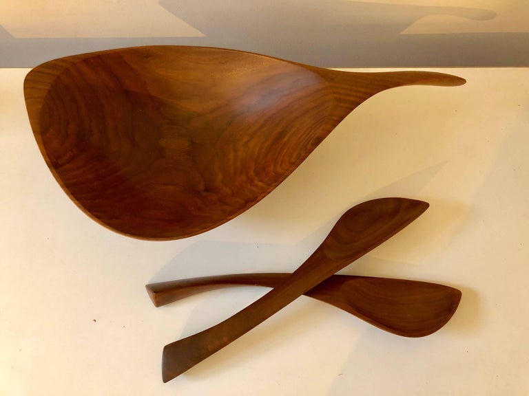 Carved from solid walnut. Beautiful lines and elegant shape. Signed “EMilan” to underside.

Tongs are 12