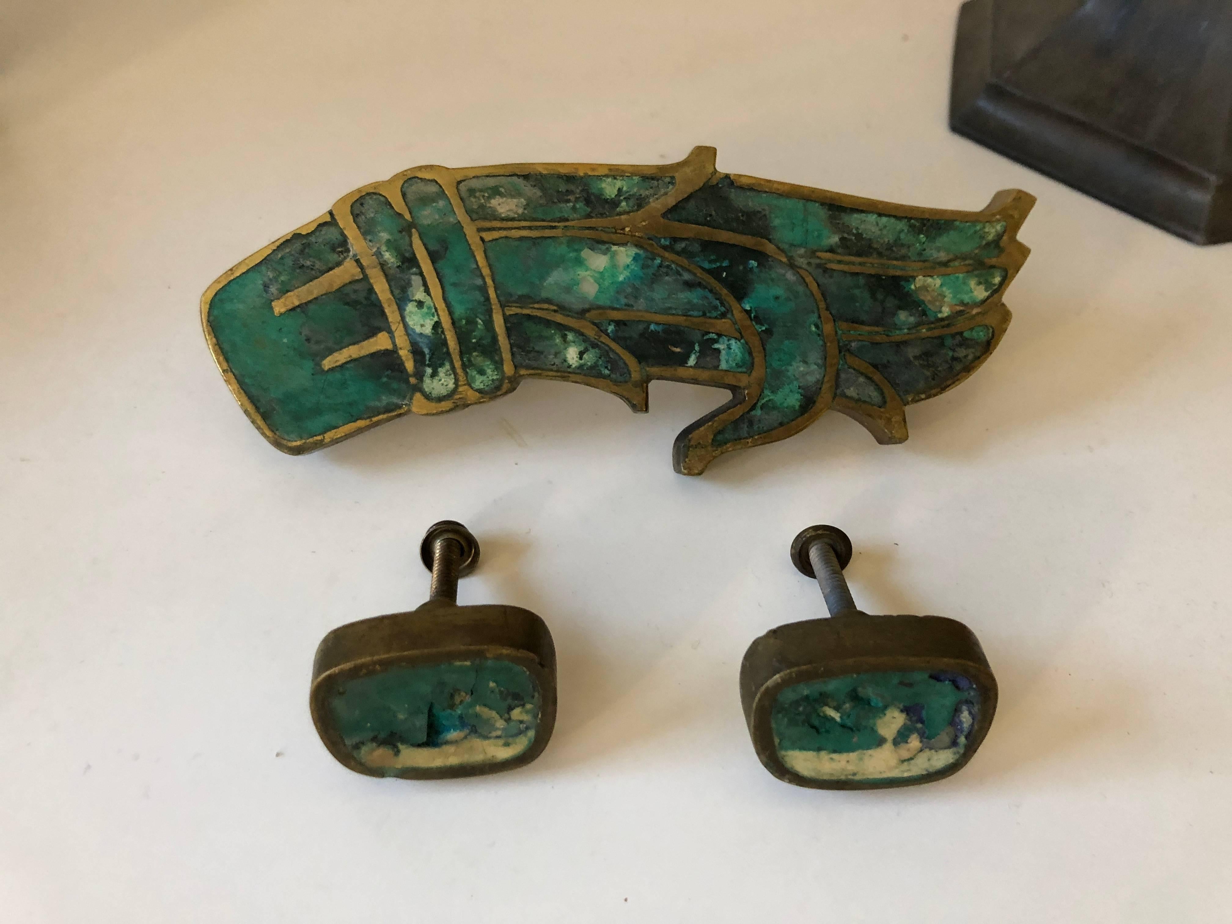 Mid-century Pepe Mendoza drawer pulls in brass with ceramic inlay. The larger is signed with impressed manufacturer's mark [Mendoza Hecho en Mexico].  Three pieces total. 