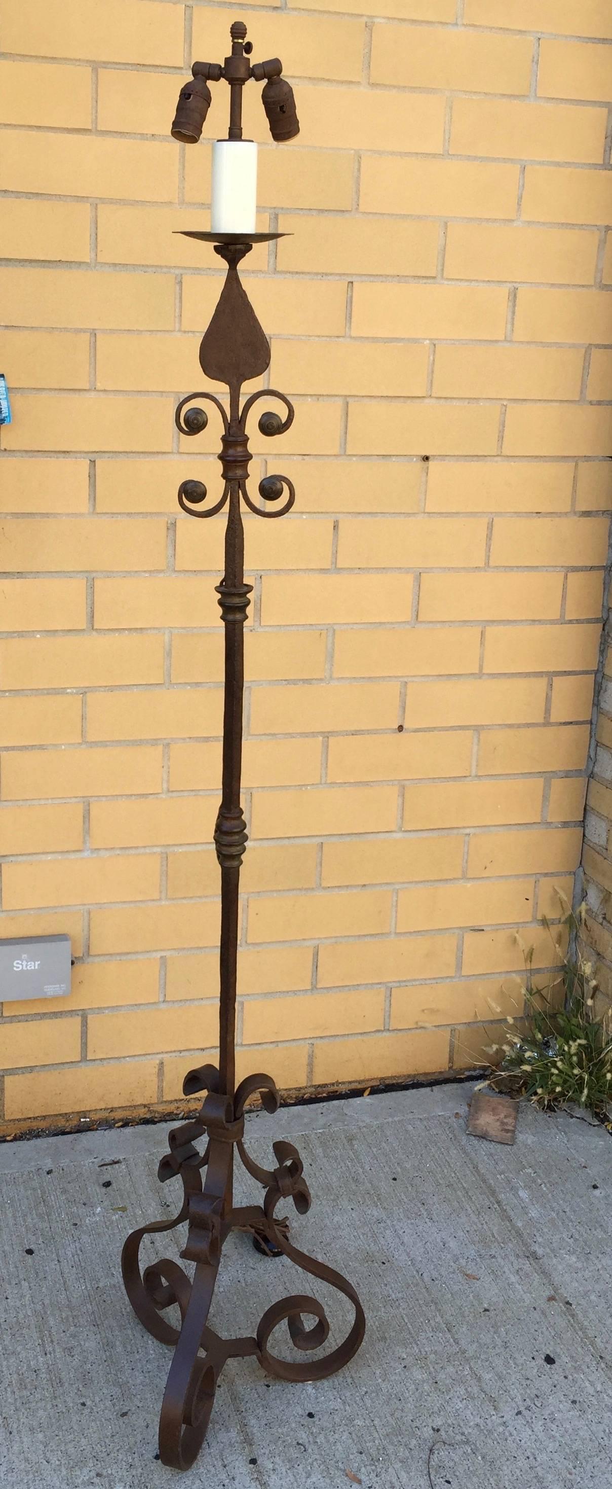 Wonderful hand-wrought iron lamps with controlled rust patina surface and bronze elements.